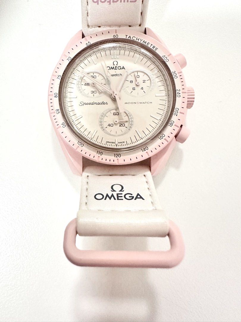 Swatch x Omega Speedmaster MoonSwatch (Category: Luxury Watches) located in Manila. Submitted by luxestuffph (Listing ID 1423829086, Image 3). Description: Swatch x Omega Speedmaster MoonSwatch - Mission to Venus. Pink case, white strap. -Used only for 2-3 times -Comes with box -100% Authentic -Purchased in Austria in 2022 -In very good condition except for the slight discoloration (dirt build up) on its strap but barely noticeable.