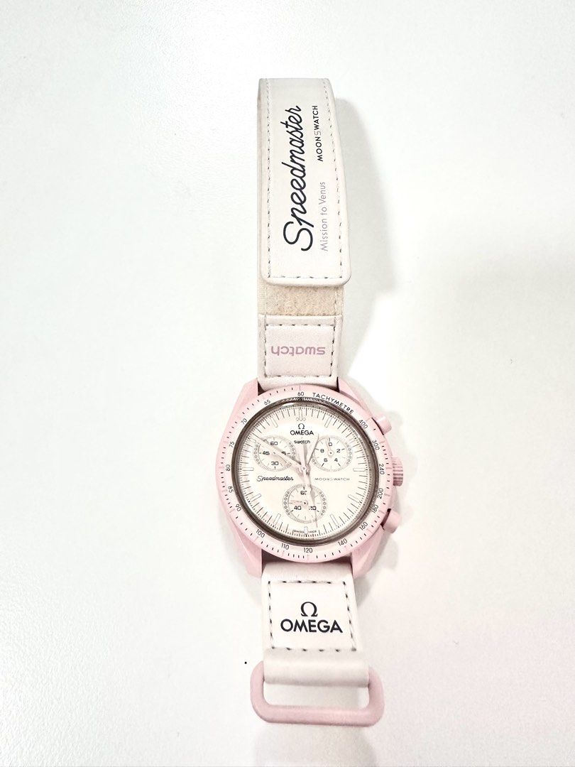 Swatch x Omega Speedmaster MoonSwatch (Category: Luxury Watches) located in Manila. Submitted by luxestuffph (Listing ID 1423829086, Image 2). Description: Swatch x Omega Speedmaster MoonSwatch - Mission to Venus. Pink case, white strap. -Used only for 2-3 times -Comes with box -100% Authentic -Purchased in Austria in 2022 -In very good condition except for the slight discoloration (dirt build up) on its strap but barely noticeable.