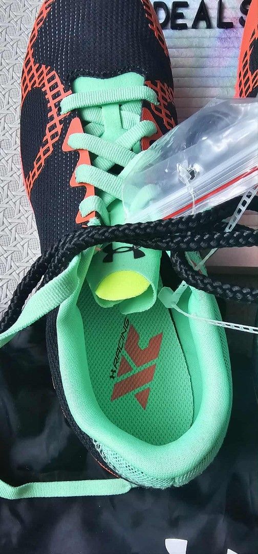 Under Armour UA Speedform Sprint 2 Running Spikes (Category: Sneakers) located in Malolos. Submitted by les0802 (Listing ID 1423851651, Image 2). Description: - Under Armour UA Speedform Sprint 2 running spikes - Stylish black and orange design with mint green accents - Includes original drawstring bag and tags - Designed for track and field events - Features multiple spikes for superior grip - Unworn condition UNDER ARMOUR RACING SHOES WITH POUC