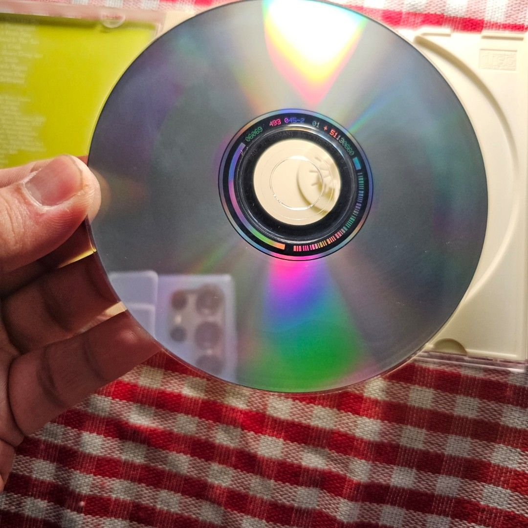 Weezer - Weezer (Green Album) CD - CD Mint (Category: CDs & DVDs) located in Quezon City. Submitted by serefrenpaz (Listing ID 1423849804, Image 3). Description: CD of Weezer's self-titled album, also known as the Green Album. The CD features tracks like "Don't Let Go," "Photograph," and "Island in the Sun." The album art features the band members on a green background. The CD is in its original jewel case and includes the booklet with lyrics and