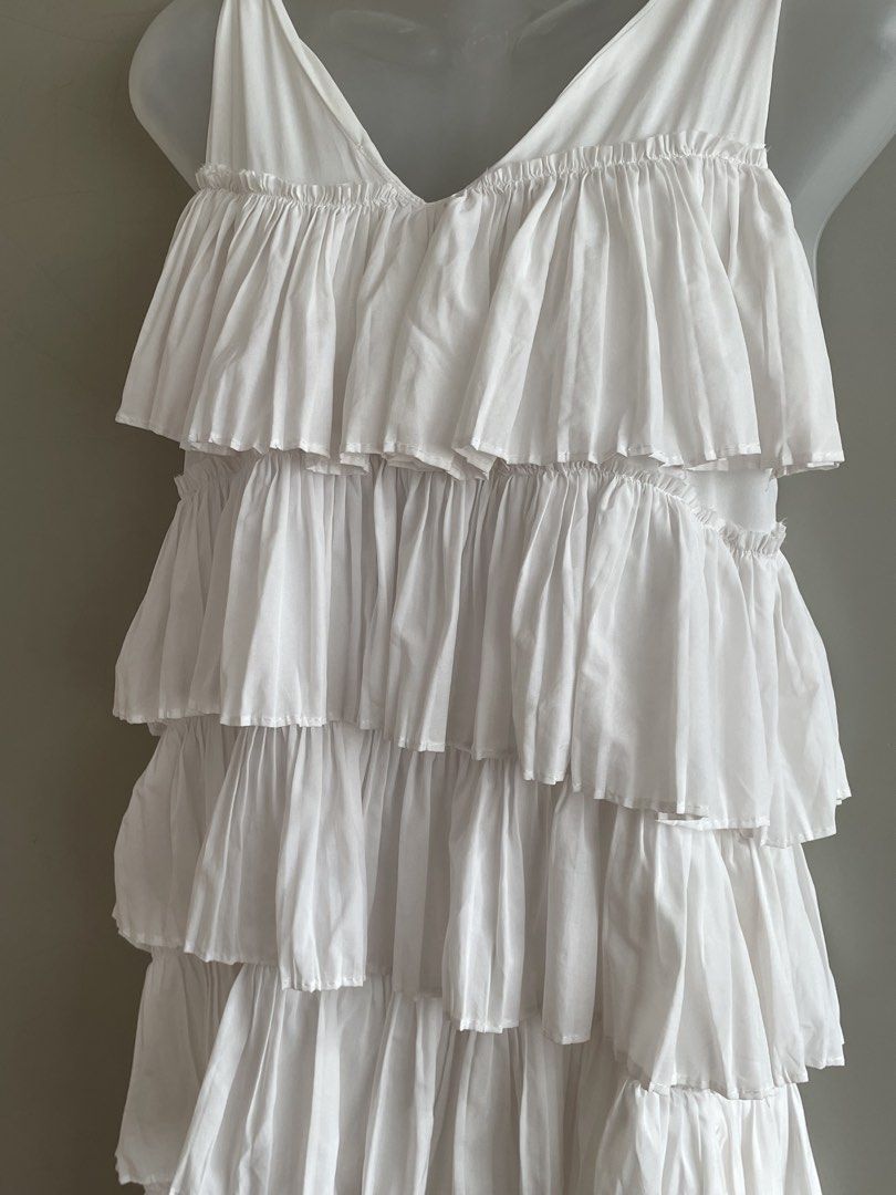 White Ruffle Tiered Midi/Maxi Dress (Category: Dresses) located in Paranaque City. Submitted by beamiscellaneous (Listing ID 1423854888, Image 2). Description: Thrifted maxi dress with tiered ruffles. V-neck, sleeveless. Lightweight and flowy. Perfect for warm weather. 47” length. Free size. RFS: decluttering.