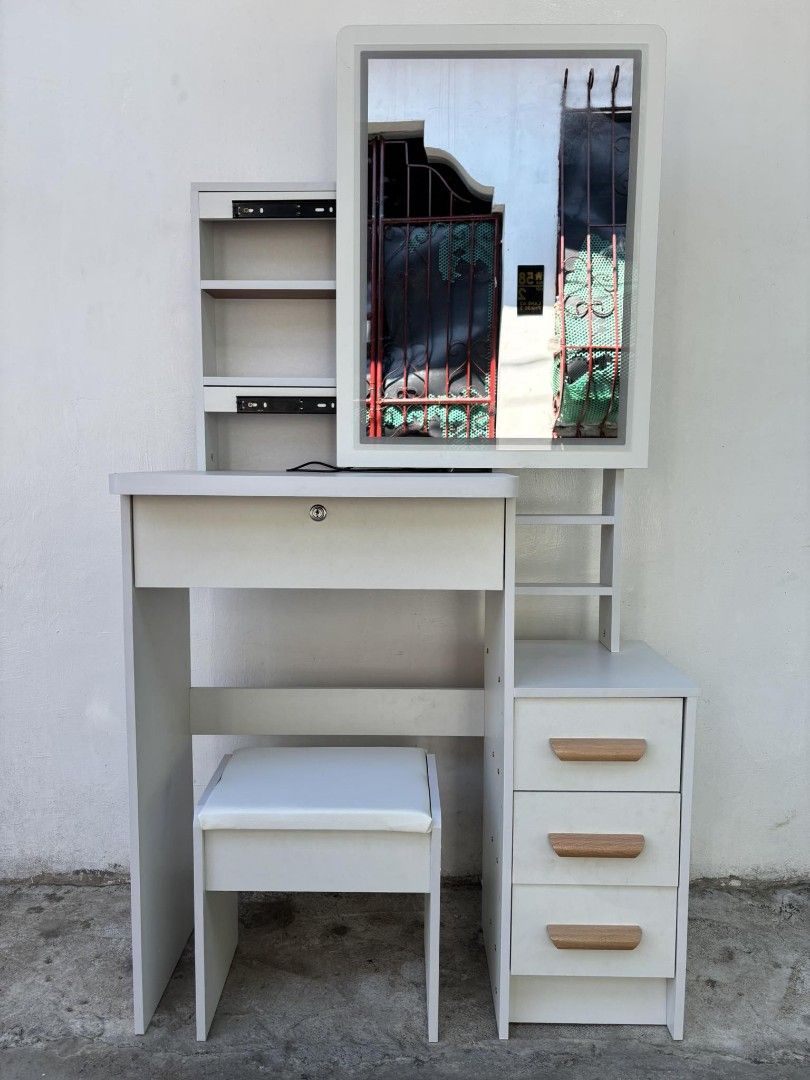 White Vanity Table with LED Mirror and Stool (Category: Tables & Sets) located in Manila. Submitted by dolorchris69891 (Listing ID 1423857066, Image 3). Description: - White vanity table with LED mirror and matching stool - Multiple shelves and three drawers for storage Vanity mirror MALAKI YAN SA PERSONA38. TOUCHSCREEN NA D WITH LED LIGHts.