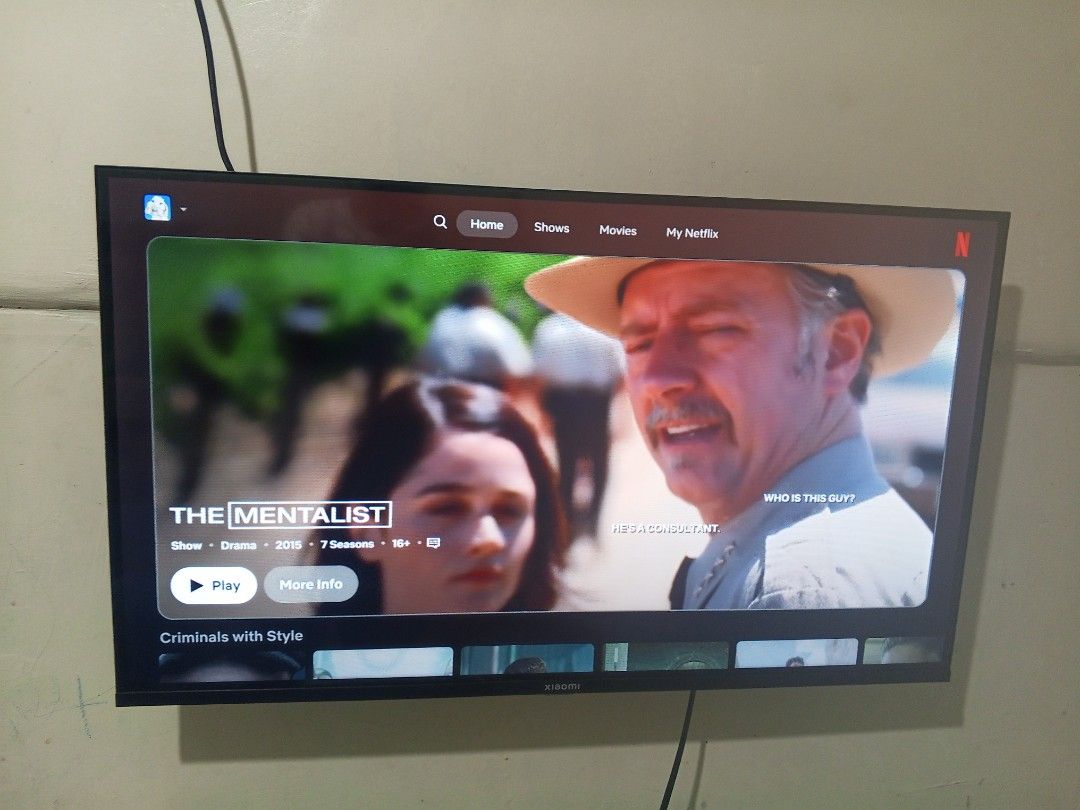 Xiaomi Smart TV / Google TV (Category: TV) located in Manila. Submitted by zeus025 (Listing ID 1423958103, Image 1). Description: - Xiaomi Smart TV with Google TV - Netflix pre-installed - Wall-mounted - Currently showing Netflix home screen and a scene from "The Mentalist" Unit and Remote only.