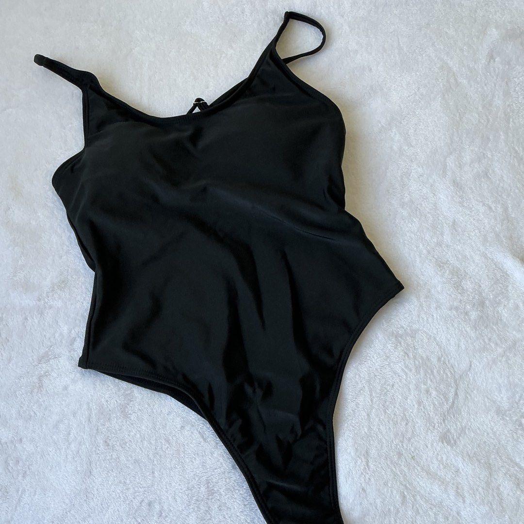 XS | Black One-Piece Swimsuit (Category: Bikinis & Swimsuits) located in Manila. Submitted by vxnclo (Listing ID 1423944646, Image 1). Description: - Sleek black one-piece swimsuit - High-cut leg design - Adjustable straps - Stylish criss-cross back - Made from a smooth, stretchy material - Flattering silhouette - 12.5" waist laid flat.