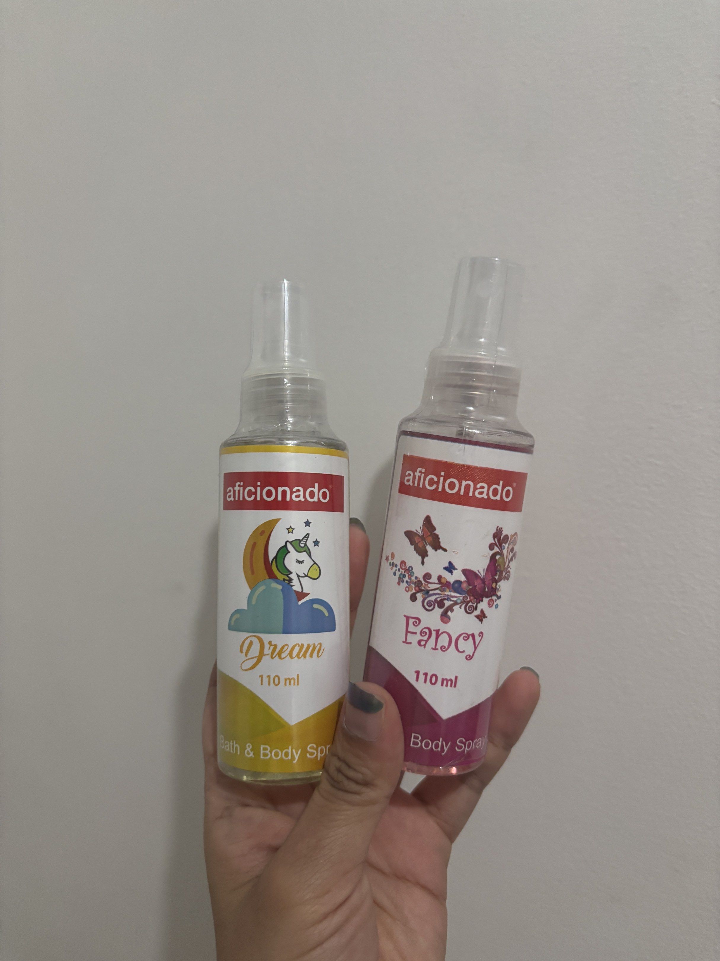 Aficionado Bath & Body Spray (Category: Fragrance & Deodorants) located in Quezon City. Submitted by mjcapt (Listing ID 1419506214, Image 1). Description: Two Aficionado bath and body sprays. One is Dream, and the other is Fancy. Both are 110 ml. The Dream spray has a unicorn and moon design, while the Fancy spray has a butterfly design. Price is for both..