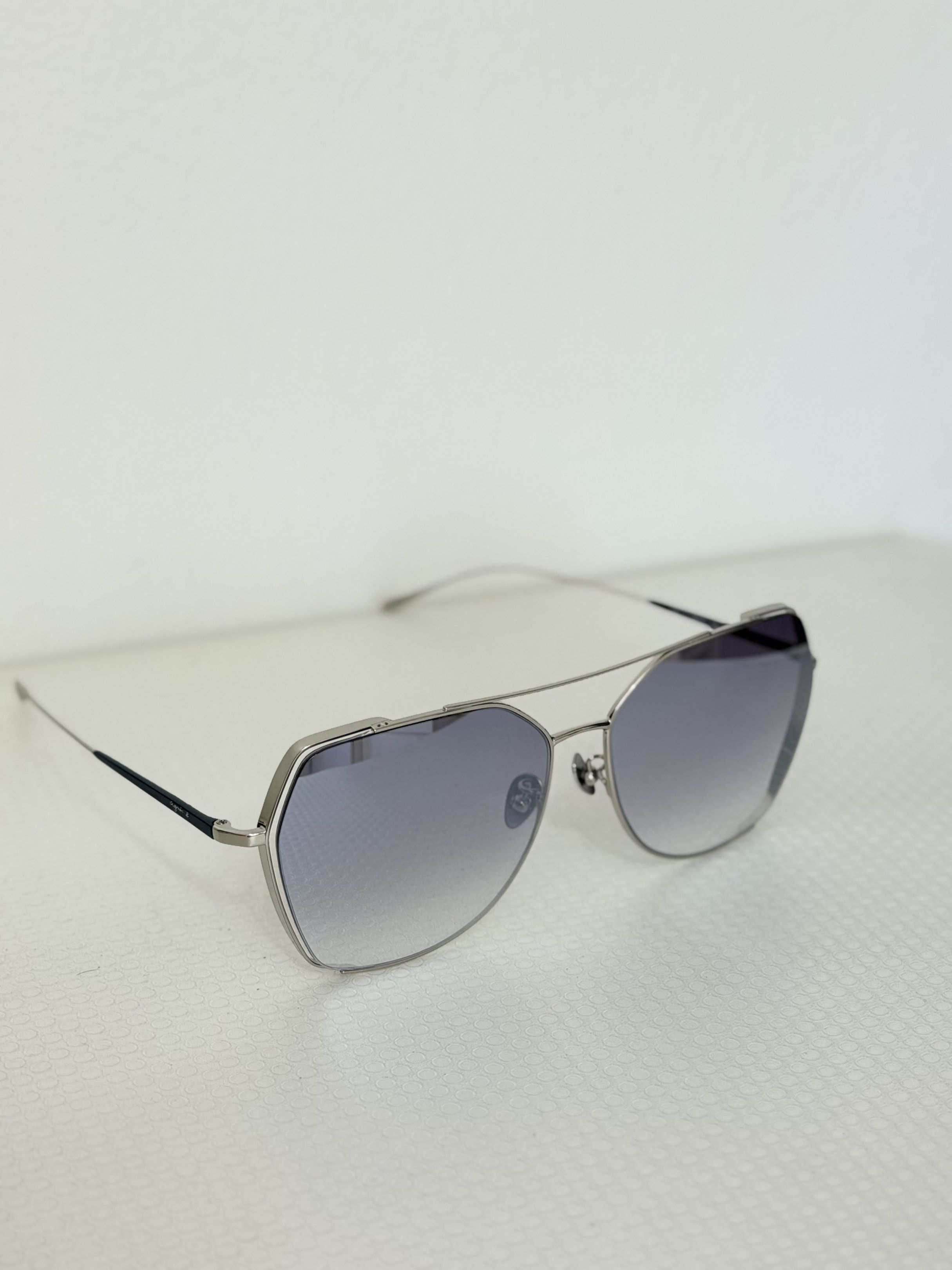 Agnes B. Sunglasses (Category: Sunglasses & Eyewear) located in Quezon City. Submitted by ms.glamdeclutter (Listing ID 1419475818, Image 3). Description: - Agnes B. sunglasses - Silver frame - Gradient lenses - Includes black case and cleaning cloth - Unique geometric shape - Adds elegance to any outfit.