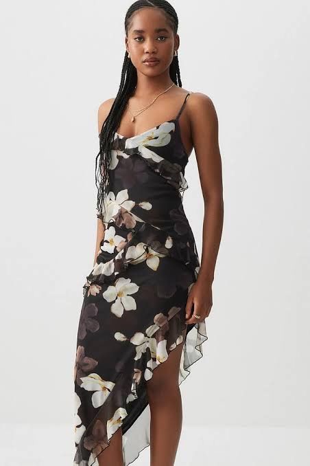 Ardene Floral Ruffle Dress (Category: Dresses) located in Iloilo. Submitted by geybrieeeel (Listing ID 1419498273, Image 1). Description: Dress features a beautiful floral print with a black base and white and brown flowers. It has a layered ruffle design and spaghetti straps. The dress is from Ardene and is size XS. 📌 Used once only .