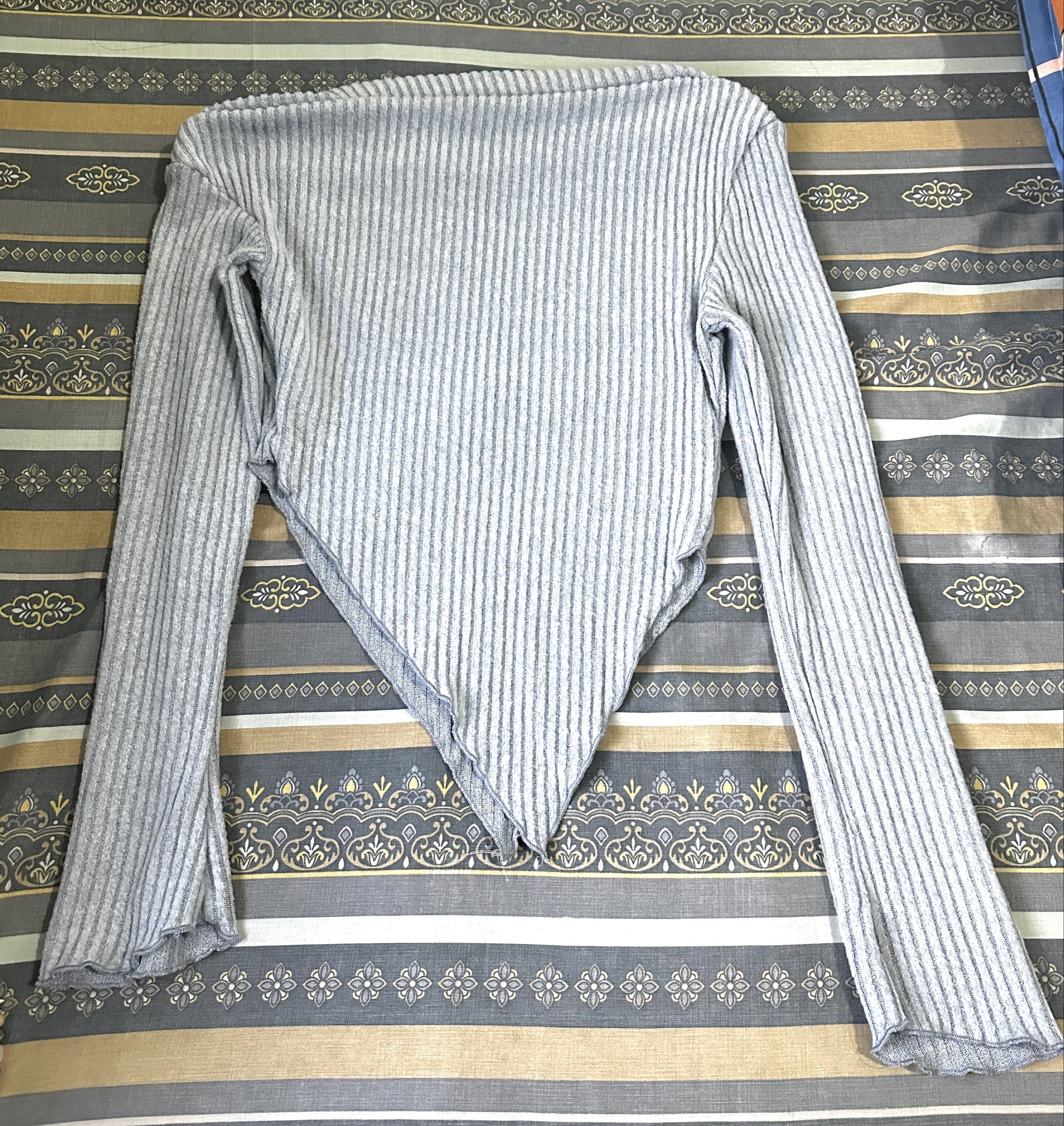 Asymmetrical Neck Lettuce Trim Ruched Top (Category: Blouses) located in Angeles City. Submitted by n_cln (Listing ID 1419417605, Image 3). Description: - Dusty blue in color (current pic is affected by lighting) - asymmetrical neckline, ribbed knit fabric w/ lettuce trim (see pic for material details) - slightly stretchable & hugs the body, very flattering esp for inverted triangle body types - never worn, washed & stored only - fits XS-M (slim 