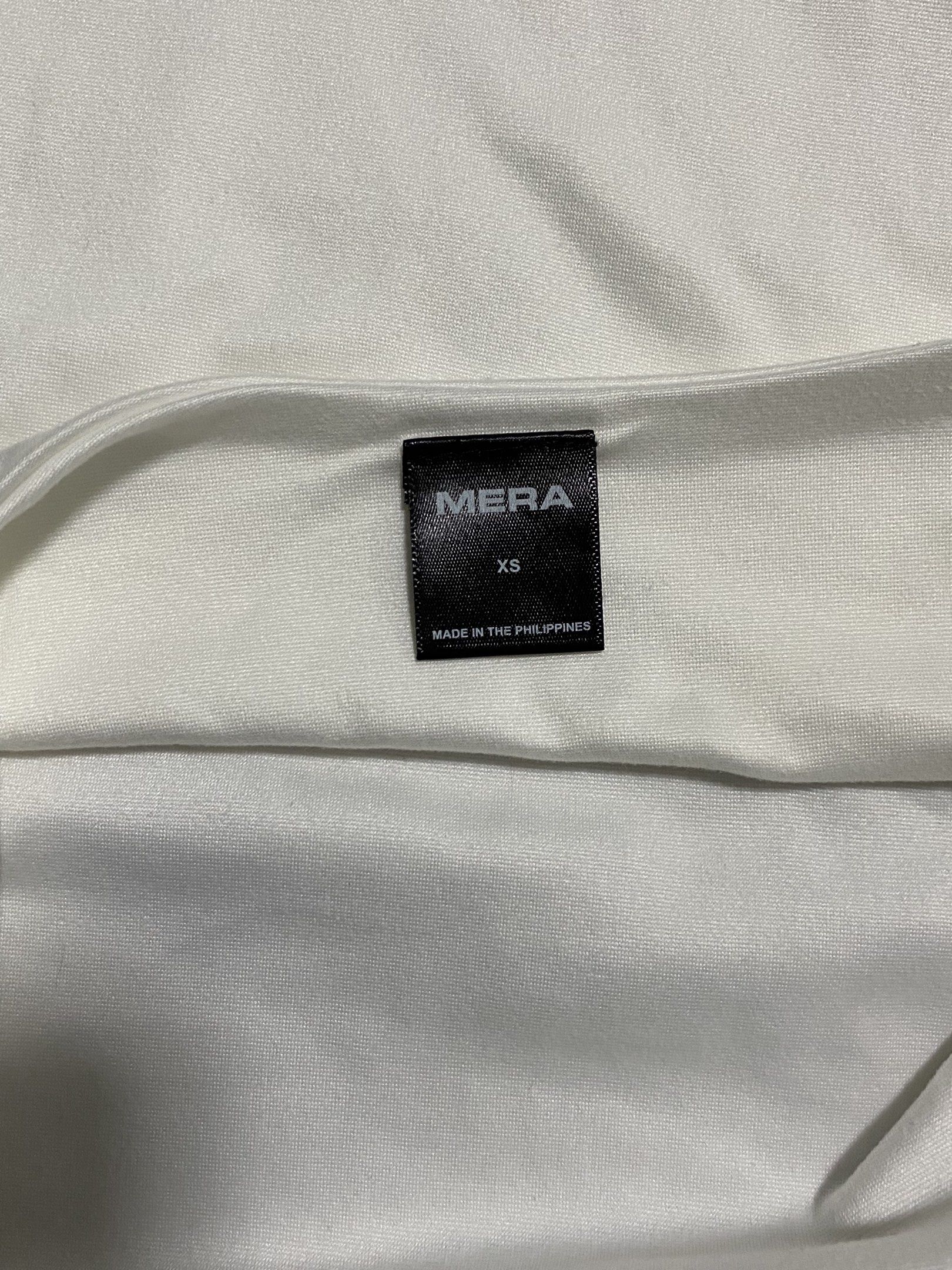 B1T1 MERA TOP (Category: Sleeveless) located in Bulacan. Submitted by rcs_shop09 (Listing ID 1419573772, Image 3). Description: top 1 - white mera halter top (xs) top 2 - jacinta acid gray halter top (xs) brand: mera material: cotton spandex - both worn once - body hugging .