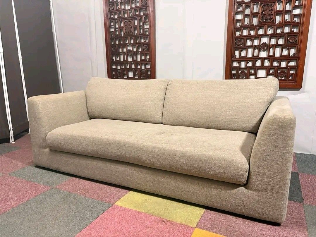 Beige Fabric Sofa (Category: Sofas) located in Manila. Submitted by eloizavill76462 (Listing ID 1419483355, Image 1). Description: - Beige fabric sofa - Two-cushion design - Wide, integrated armrests - Neutral color - Well-maintained - Ready for use.