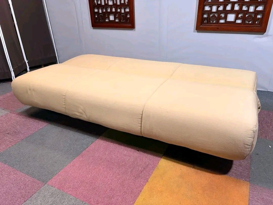 Beige Sofa Bed (Category: Sofas) located in Manila. Submitted by eloizavill76462 (Listing ID 1419483656, Image 2). Description: - Beige sofa bed - Modern and simple design - Converts from sofa to bed - Soft, neutral-colored fabric - Well-padded for comfort - Low profile - Features wooden legs.