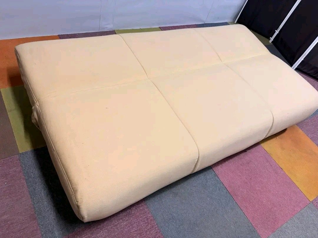 Beige Sofa Bed (Category: Sofas) located in Manila. Submitted by eloizavill76462 (Listing ID 1419483656, Image 3). Description: - Beige sofa bed - Modern and simple design - Converts from sofa to bed - Soft, neutral-colored fabric - Well-padded for comfort - Low profile - Features wooden legs.