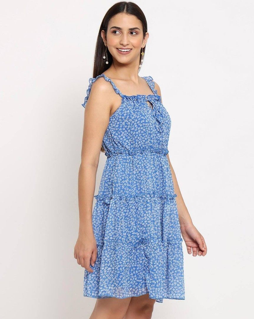 Blue Floral Tiered Dress (Category: Dresses) located in Batangas. Submitted by yanaspreloved2 (Listing ID 1419494511, Image 2). Description: - Blue floral print - Tiered design - Square neckline with ruffle straps - Fitted waist - Flowy mini skirt - Ideal for casual or summer occasions.