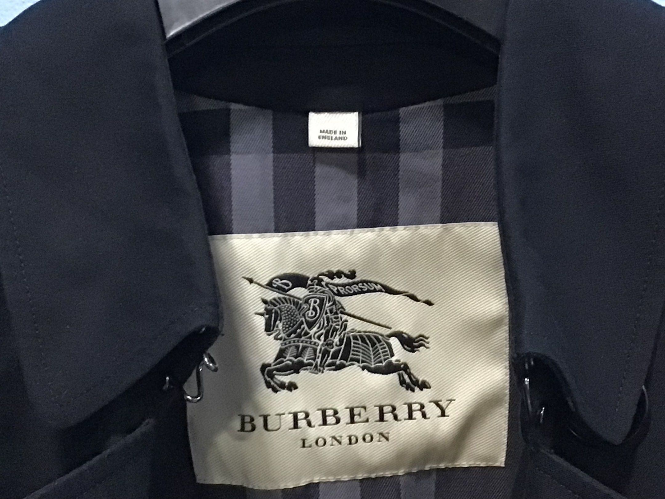 Burberry London Trench Coat (Category: Coats, Jackets and Outerwear) located in Makati City. Submitted by ilaw72 (Listing ID 1419411041, Image 3). Description: MADE IN ENGLAND •Authentic Burberry London trench coat •Elegant black color •Cotton •Twill weave •Storm flap •Classic collar •Double-breasted style button fastening •Detachable waist belt •Belt loops •Epaulettes •Long sleeves •Belted cuffs •Two front button-fastening jetted pockets •Button