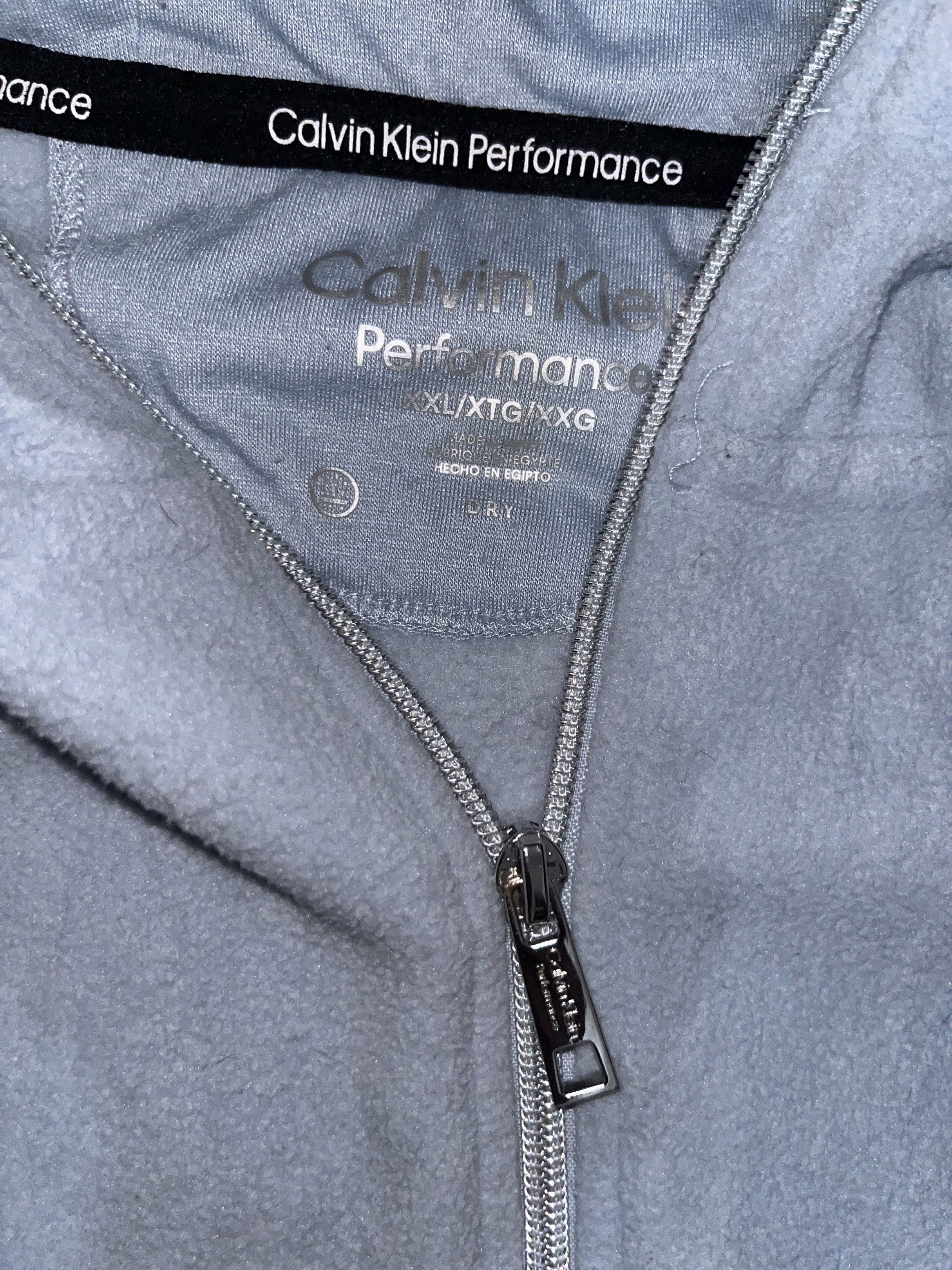 Calvin Klein Performance Hoodie (Category: Coats, Jackets and Outerwear) located in Lipa City. Submitted by coolthreadss (Listing ID 1419460495, Image 3). Description: - Light blue Calvin Klein Performance hoodie - Full zip closure - Hooded - Calvin Klein Performance logo on sleeve - Size: XXL/XG/XXG - Two front pockets.