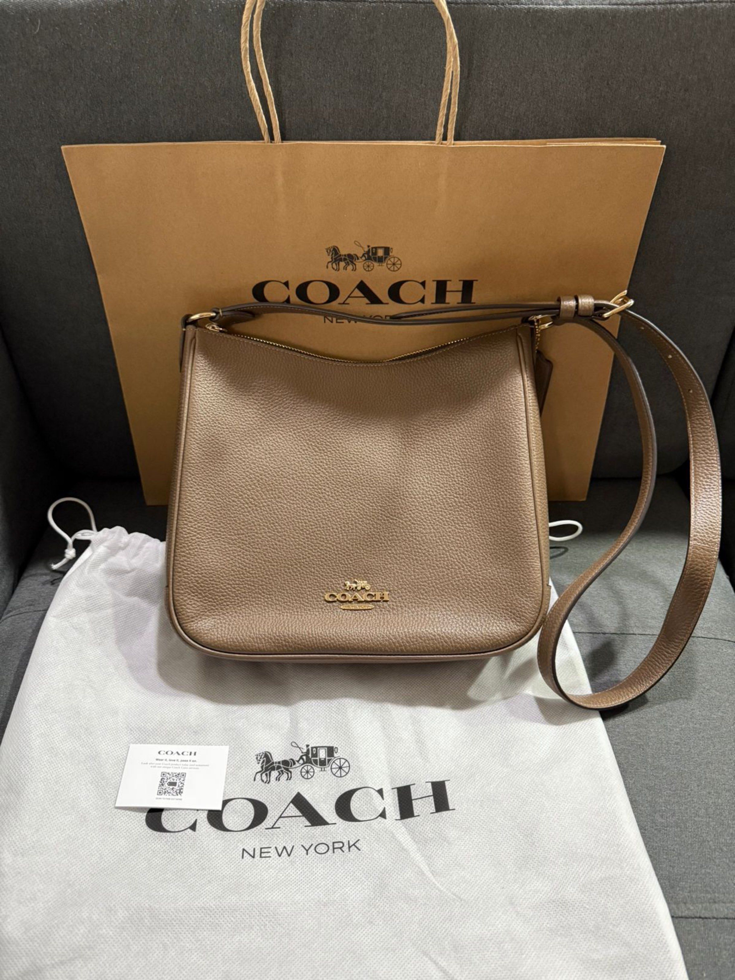 Coach Shoulder Bag (Category: Luxury Bags & Wallets) located in Pasay City. Submitted by conifrancis (Listing ID 1419513401, Image 1). Description: - Coach shoulder bag - Neutral / brown color - Zip closure and the back also has a zipper pocket - Adjustable shoulder strap - Interior pocket - Includes dust bag and Coach paper bag - Made of Refined Pebble Leather × Nappa Leather.