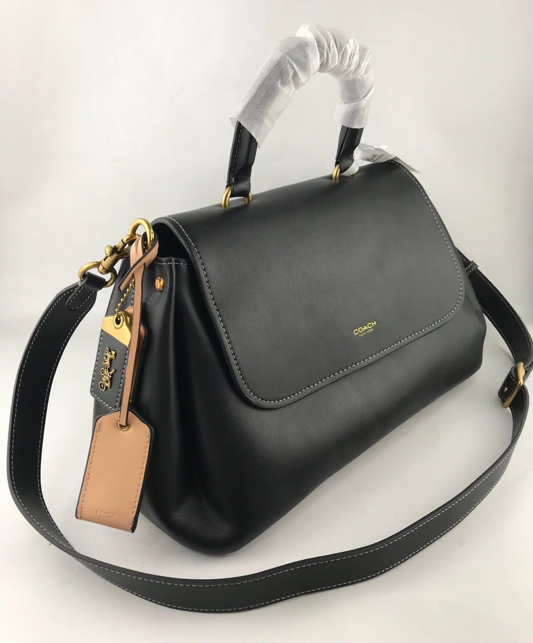 Coach Slouchy Rogue Top Handle Bag (Category: Cross-body Bags) located in Marikina City. Submitted by smthxtra (Listing ID 1419538677, Image 3). Description: Length: 14.0” Height: 8.25” Width: 6.25” Top handle with 4” drop Detachable strap with 21.5” drop for shoulder or crossbody wear Outside zip pocket Inside zip pocket Pushlock closure Four protective feet at base With tag, care card, dust bag, and paper bag included.