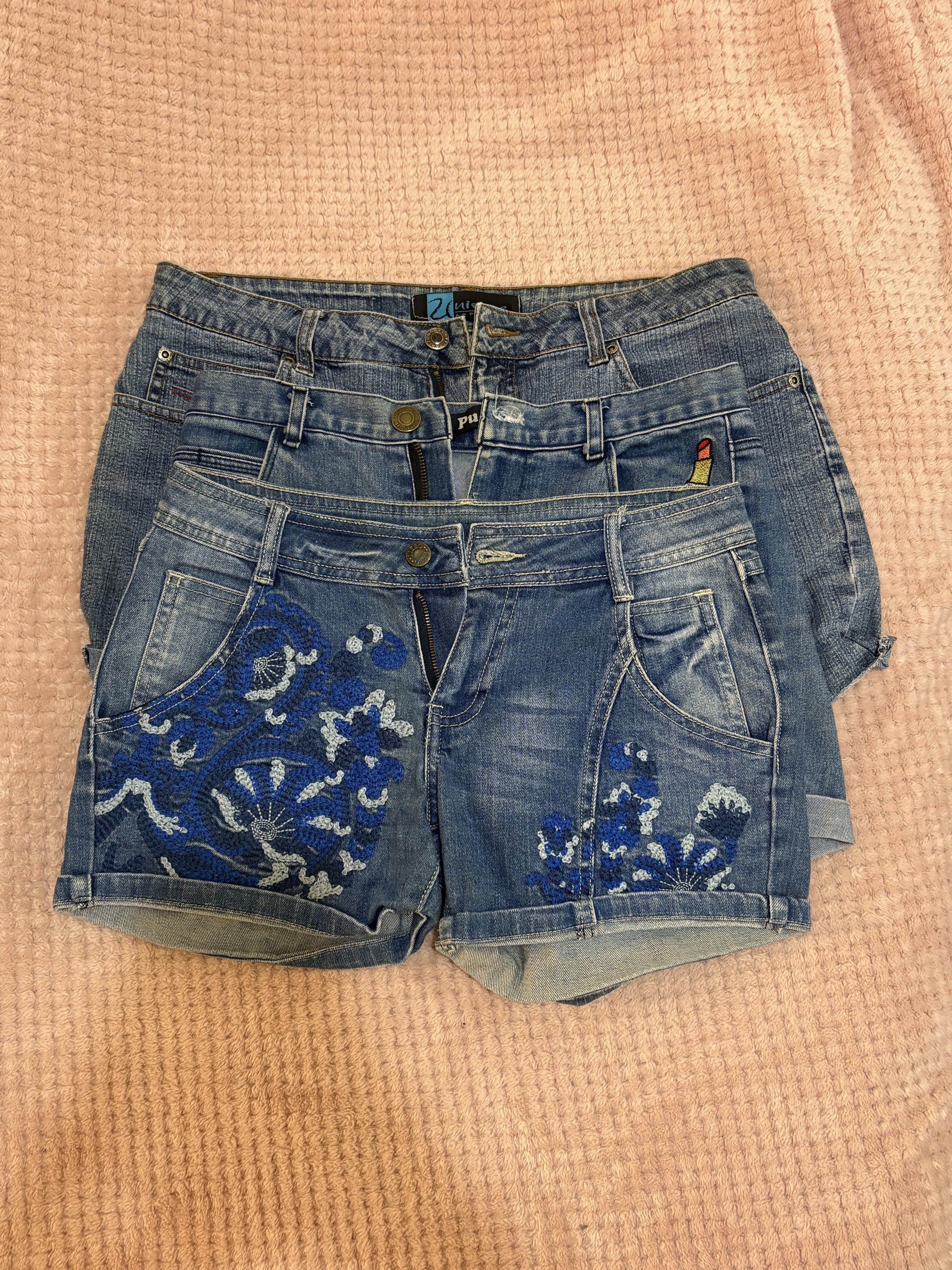 Denim Shorts BUNDLE OF 3 (Category: Shorts) located in Manila. Submitted by lustreloom (Listing ID 1419530514, Image 1). Description: - Denim shorts bundle. - Includes: - Embroidered pair - Lipstick design pair - Simple design pair - Classic denim wash. - Perfect for casual wear. - Sizes may vary. Message for measurements..