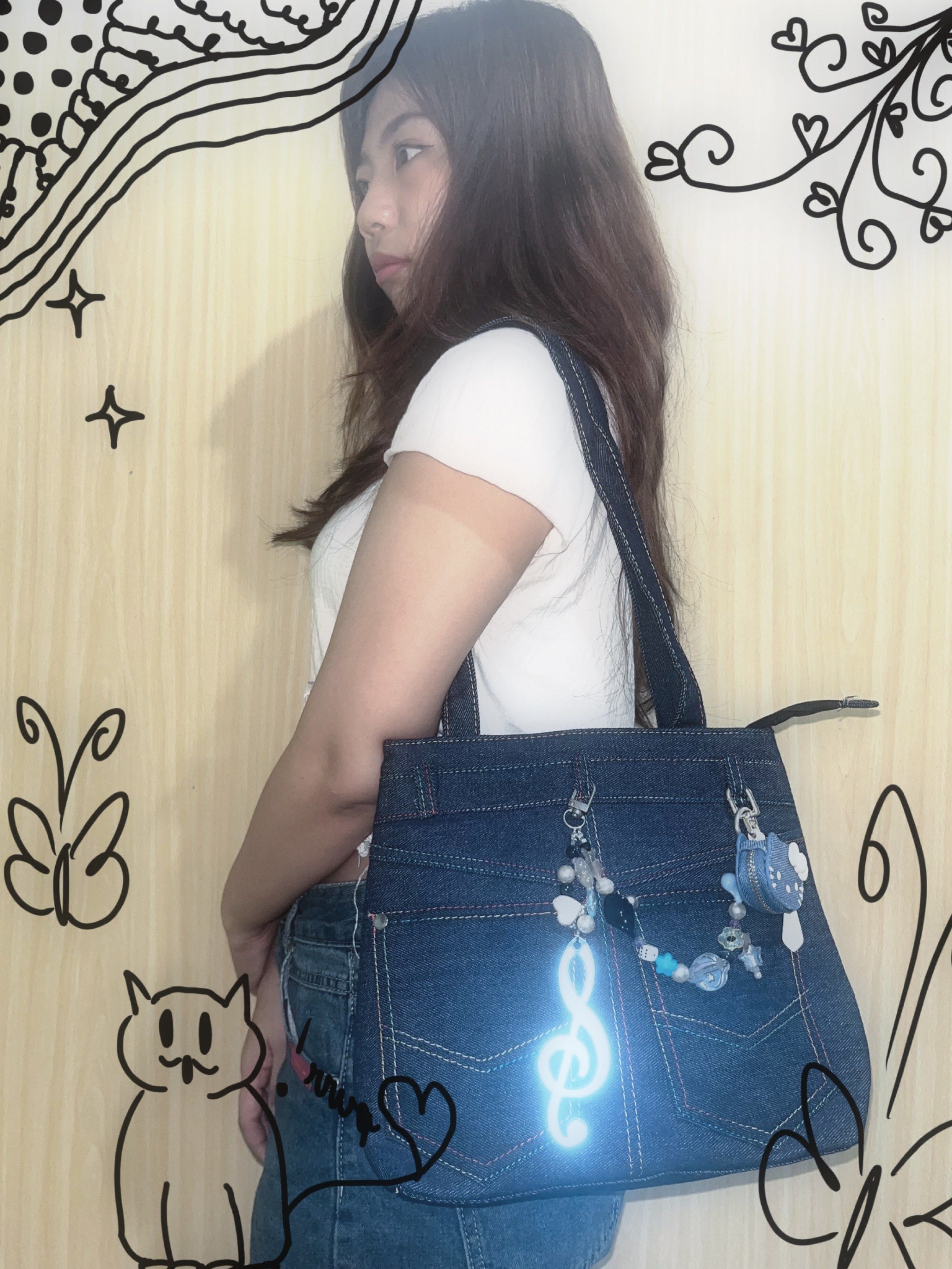 Denim Tote Bag with Charms (Category: Tote Bags) located in Makati City. Submitted by hellogaragekitty (Listing ID 1419572789, Image 3). Description: RARE HK JEANS BAG (wt anik anik) 🦋🩵✨ Reminders! ~ this item is handmade with mix of new and recycled products (specifically beads and trinkets) please set expectations accordingly 🧚🏼‍♀️ ~ color and material might differ on actual due to lighting and etc., rest assured what you see on the picture