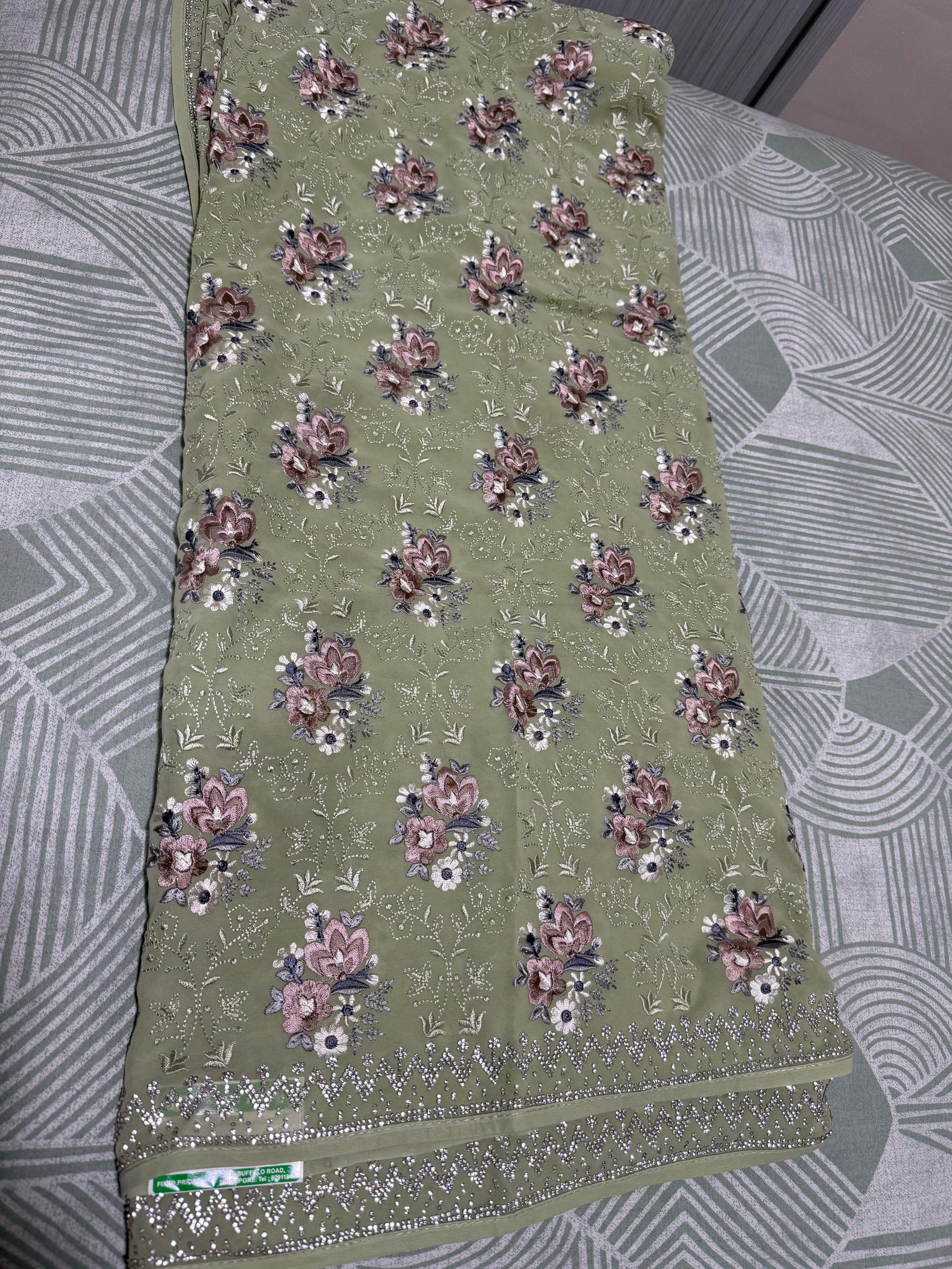 Designer Saree (Category: Traditional & Ethnic wear) located in Singapore. Submitted by neesha23 (Listing ID 1419464310, Image 1). Description: - Designer saree - Features floral embroidery and beadwork - Lovely green color - Brand new with tag - Original price: $118 .