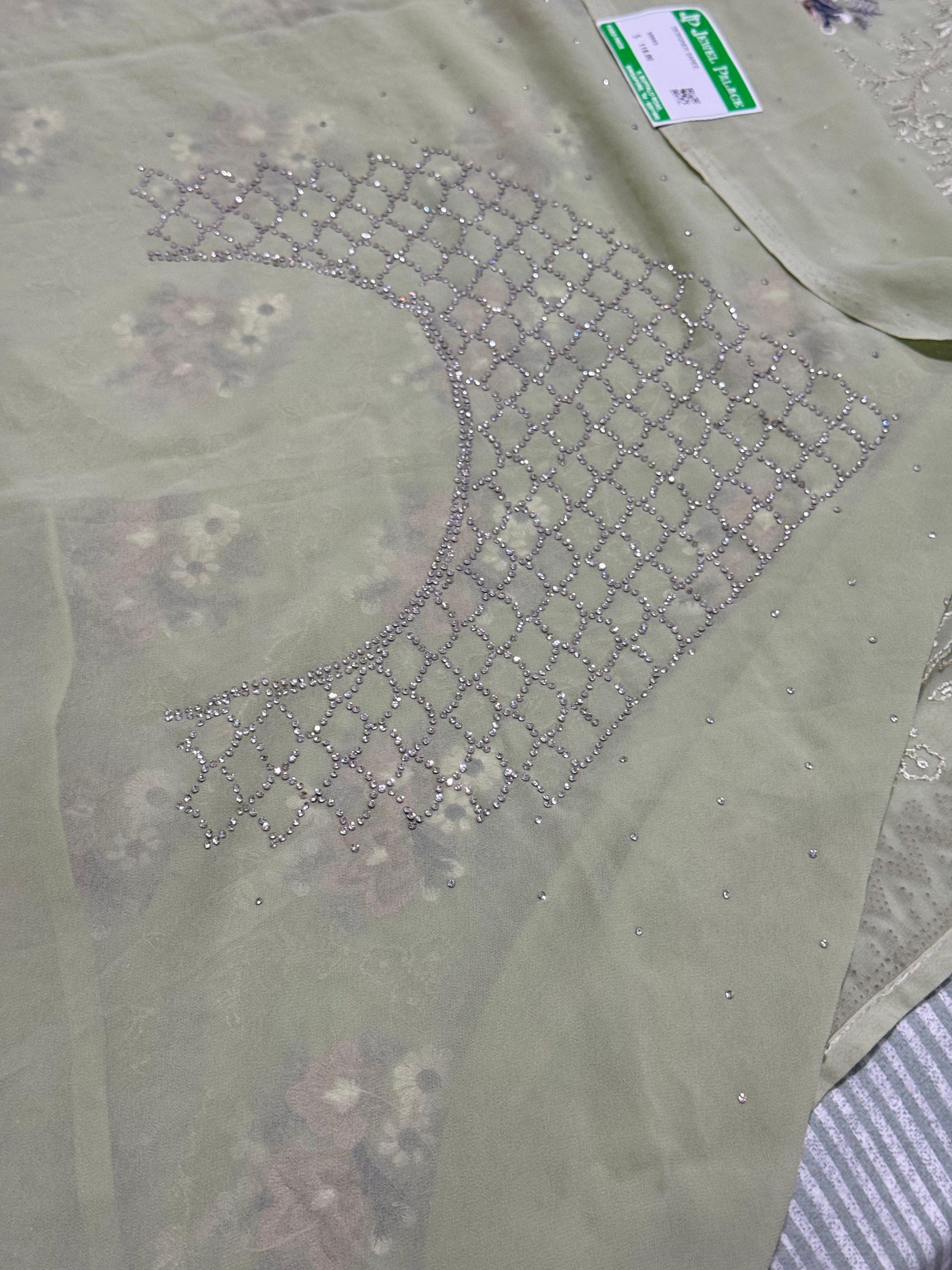 Designer Saree (Category: Traditional & Ethnic wear) located in Singapore. Submitted by neesha23 (Listing ID 1419464310, Image 3). Description: - Designer saree - Features floral embroidery and beadwork - Lovely green color - Brand new with tag - Original price: $118 .