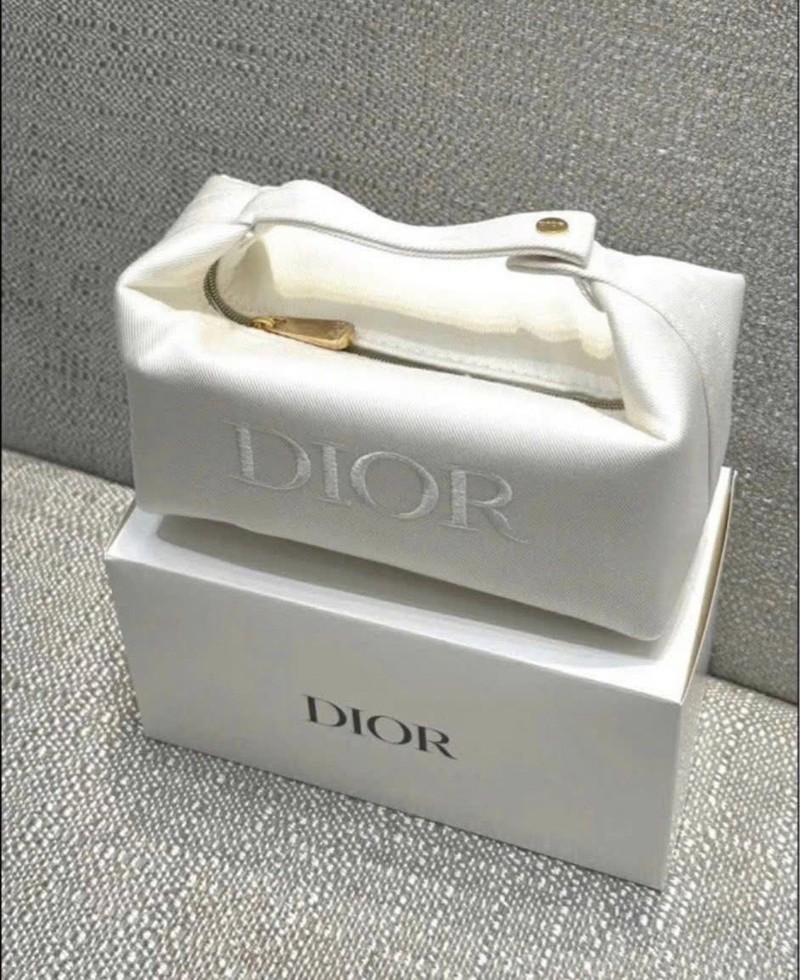 GWP Dior Cosmetic Pouch with Box (Category: Luxury Bags & Wallets) located in Cavite. Submitted by rexiedebelen (Listing ID 1419543650, Image 1). Description: - White satin exterior - Embroidered Dior logo - Zipper closure - Gold-toned button detail - Includes original white box - Perfect for makeup and small essentials GWP.