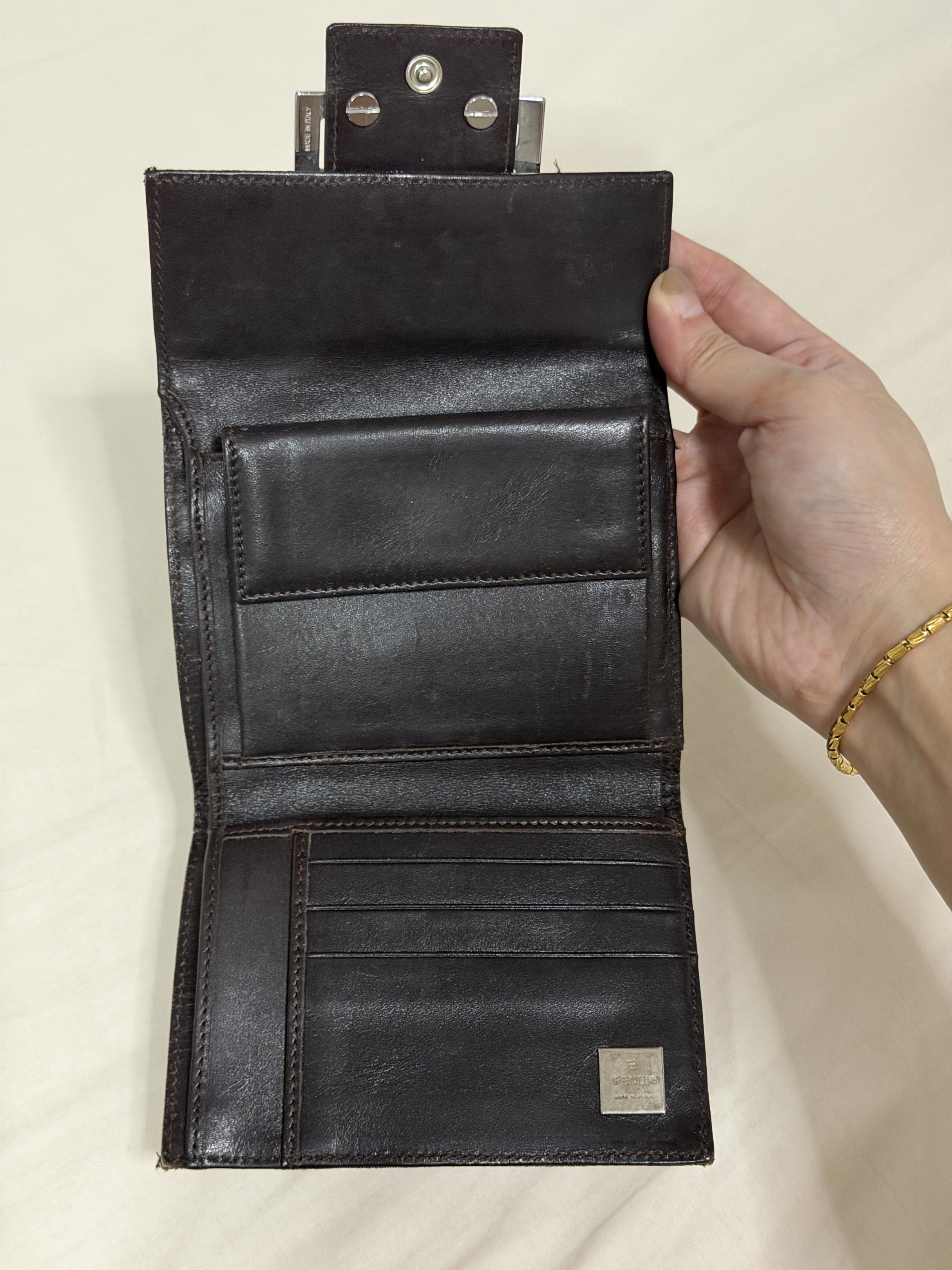 Fendi Zucchino Wallet (Category: Luxury Bags & Wallets) located in Manila. Submitted by _jkjn (Listing ID 1419501399, Image 2). Description: - Authentic Fendi Zucchino wallet - Iconic FF logo pattern - Multiple card slots - Coin compartment - Bill compartment - Leather interior - Silver-tone metal buckle closure - Color: Brown and Black.
