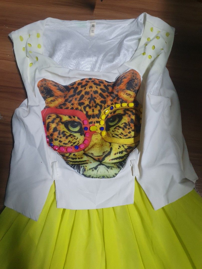 Girls' Leopard Print Dress (Category: Babies & Kids Fashion) located in Manila. Submitted by edzande (Listing ID 1419533636, Image 2). Description: - Adorable girls' dress - White top with leopard print design - Vibrant yellow skirt - Short sleeves - Round neckline - Made of flowing, lightweight fabric - Perfect for a fun and stylish look.