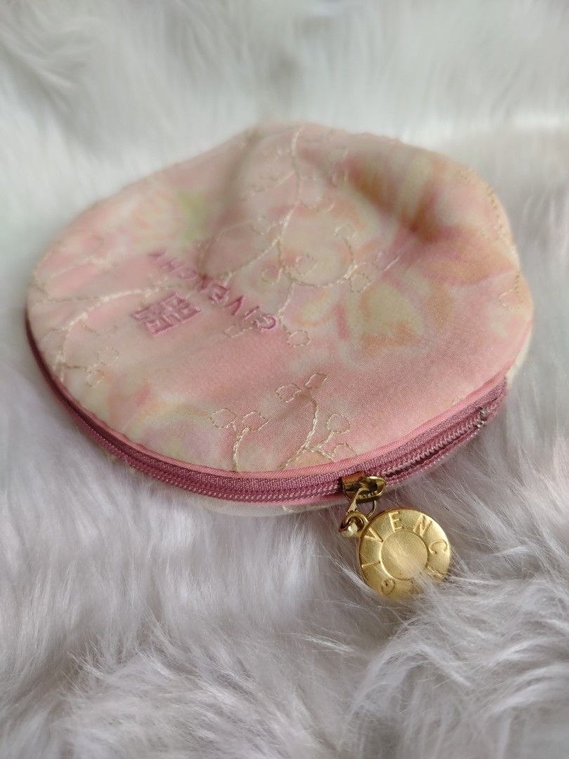 Givenchy Floral Cosmetic Pouch (Category: Luxury Bags & Wallets) located in Plaridel. Submitted by orfdnix (Listing ID 1419485483, Image 3). Description: - Givenchy cosmetic pouch - Floral design - Pink exterior - Gold charm - White interior - Zipper closure - Soft, velvety material - Givenchy logo on the front.