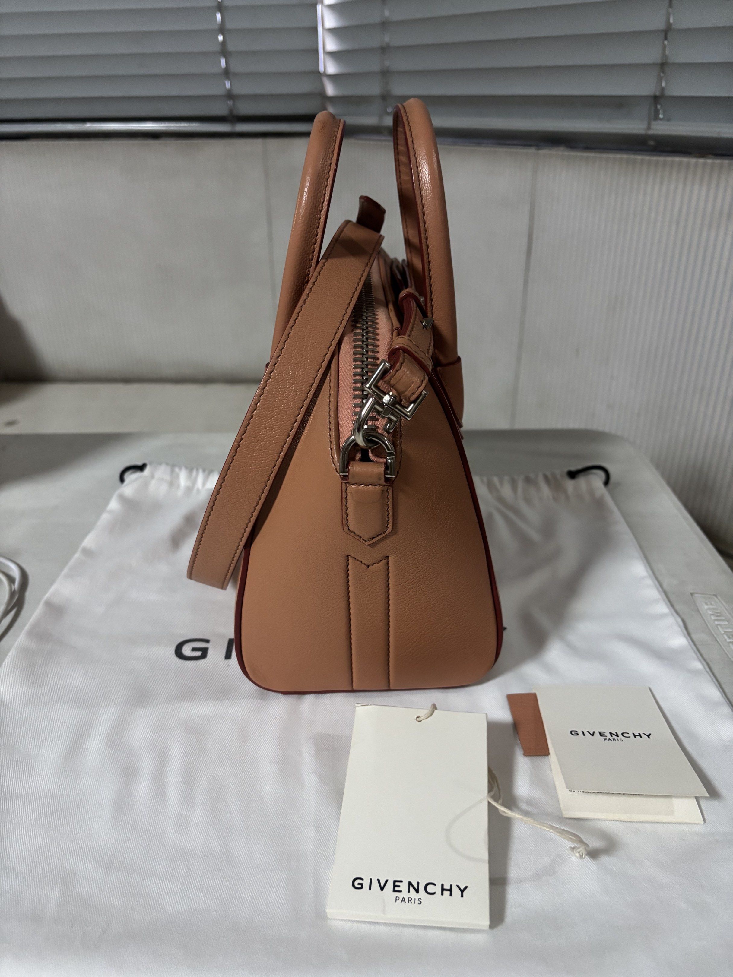 Givenchy Mini Antigona Bag (Category: Luxury Bags & Wallets) located in Quezon City. Submitted by sam.kim (Listing ID 1419541747, Image 2). Description: - Authentic, Year 2019 - Color: Pale Coral - With paper bag, dust bag and cards - 8.66 in x 7.87 in x 5.11 in - Used, good condition - Abrasion on front top handle but can be restored - Rfs: decluttering.