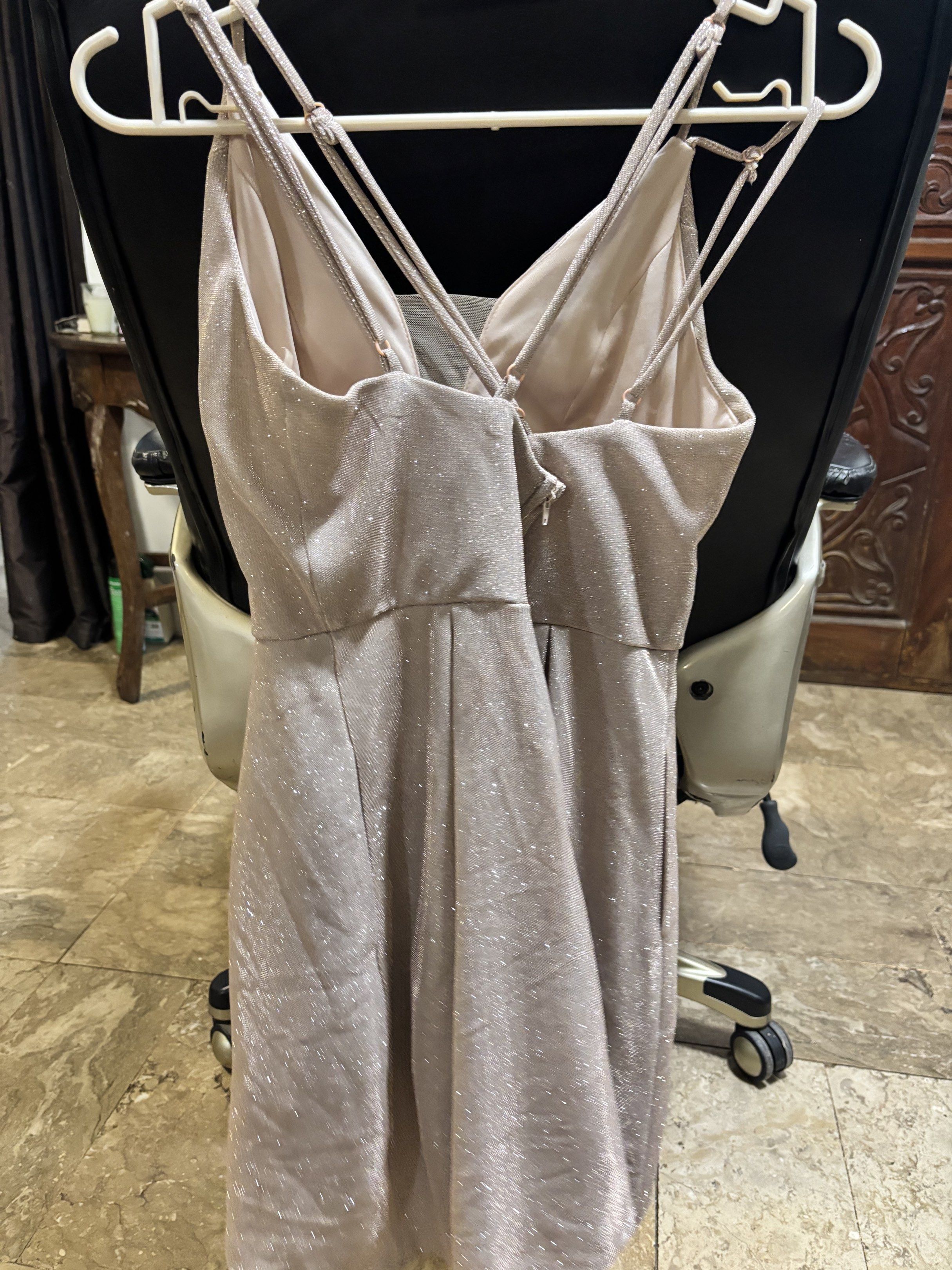Glittery Party Dress (Category: Dresses) located in Muntinlupa City. Submitted by luckywind_377dea (Listing ID 1419514778, Image 3). Description: - V-neck party dress - Spaghetti straps - Fit-and-flare silhouette - Subtle glitter finish - Back zipper closure - Ideal for parties and special occasions.