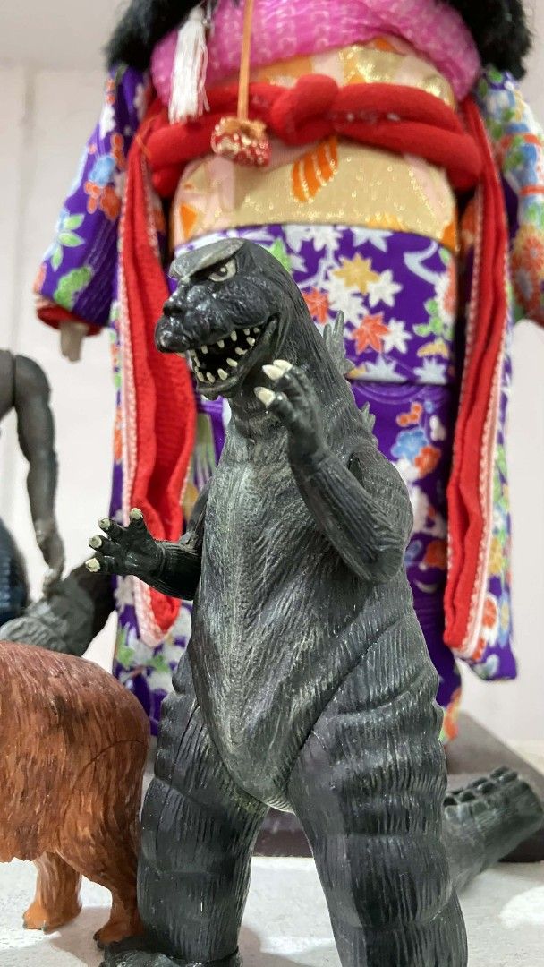 Godzilla Toy Figures Collection (Category: Figurines & Statues) located in Manila. Submitted by baloycollections2023 (Listing ID 1419554915, Image 3). Description: - Godzilla toy figure collection - Includes various Godzilla figures in different poses and colors - Features a Japanese doll and other small figures - Perfect for collectors and Godzilla fans - Ideal for display.