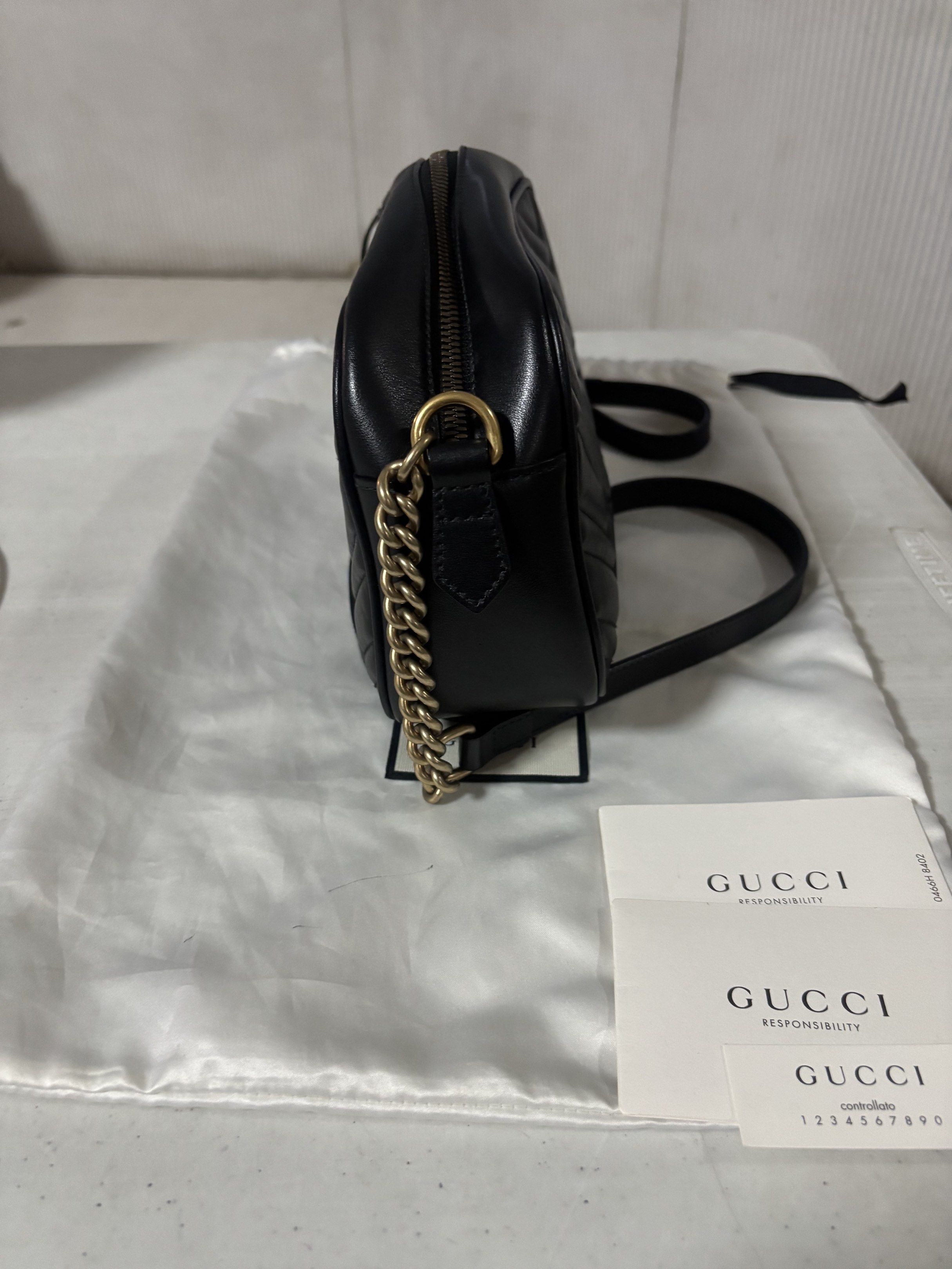 Gucci GG Marmont Small Camera Bag (Category: Luxury Bags & Wallets) located in Quezon City. Submitted by sam.kim (Listing ID 1419543259, Image 3). Description: - Authentic, Year 2019 - Color: Black - With paper bag, dust bag, and cards - W24cm x H15cm x D8cm - Used, excellent condition, dustbag with stain - Rfs: decluttering.