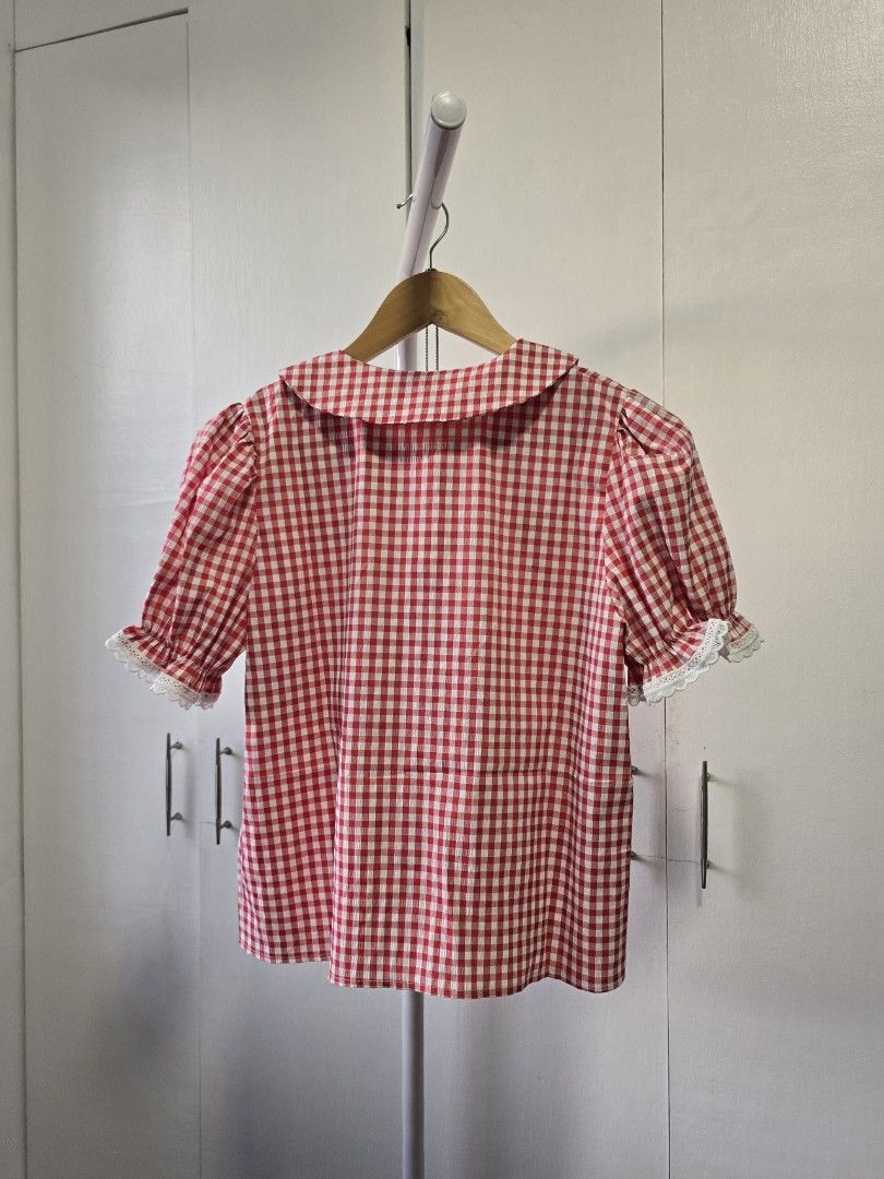 happy mint (N.N) red gingham embroidered blouse (Category: Blouses) located in Rizal. Submitted by curatedbylima (Listing ID 1419565724, Image 2). Description: - Short sleeves with lace trim - Delicate embroidery details - Button-down front - Lightweight, perfect for warm weather - Sweet and feminine style, super cute!!! freesize bust: 36 in. length: 21 in. ✨ best fits S-semi L modes of payment 💰 gcash 💰 gotyme 💰 maribank TERMS & CONDITIONS: 1