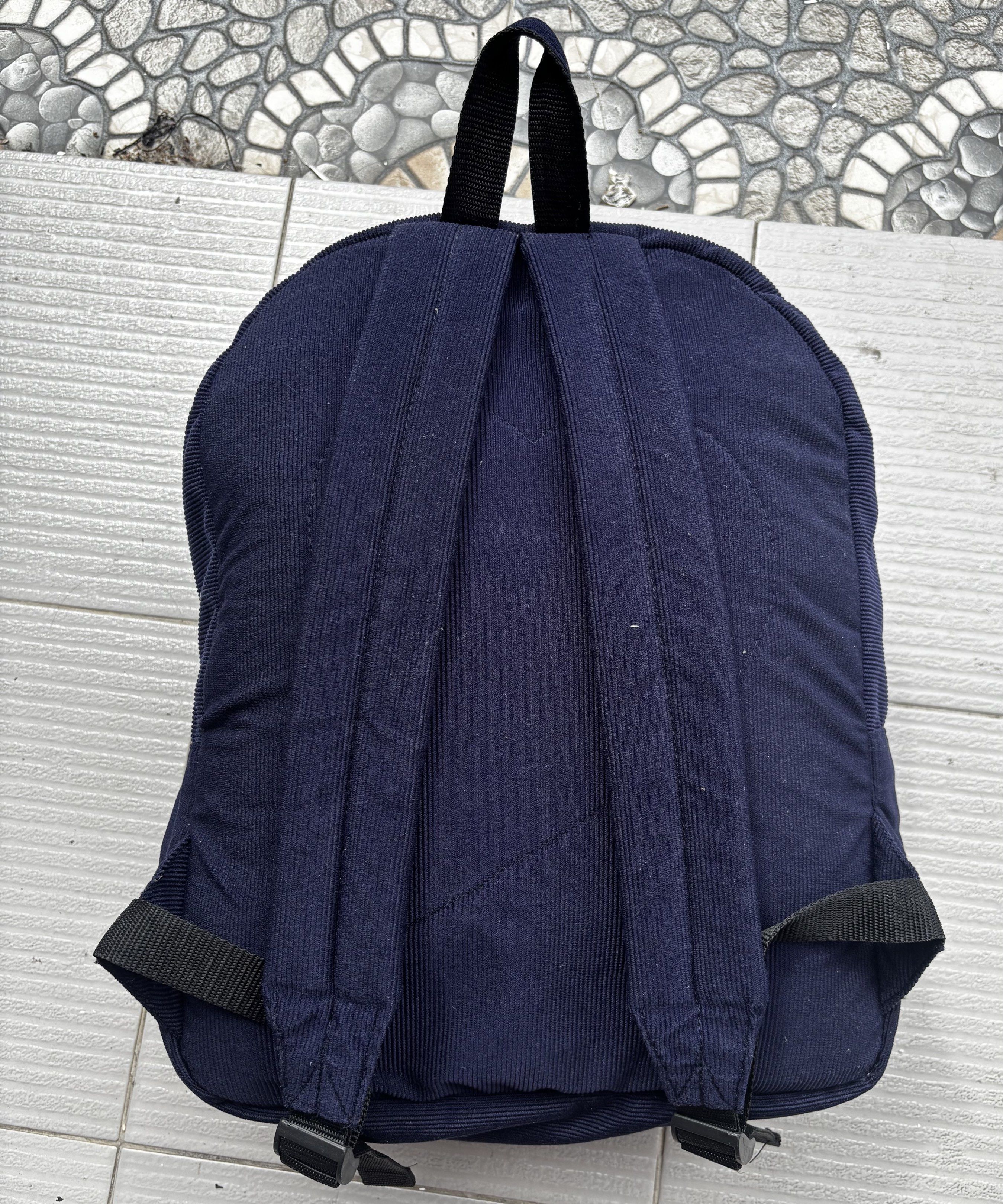 Heartstrings Corduroy Backpack (Category: Backpacks) located in Malolos. Submitted by cheerz21 (Listing ID 1419541032, Image 2). Description: - Navy blue corduroy backpack from Heartstrings. - Front pocket with zipper. - laptop compartment - Heartstrings branded zippers. - Adjustable straps. - Top handle. - Light-colored interior lining. - Heartstrings logo on front pocket. -No flaws/ issues #backpack #bag #unisexbag #heartstringsbag .