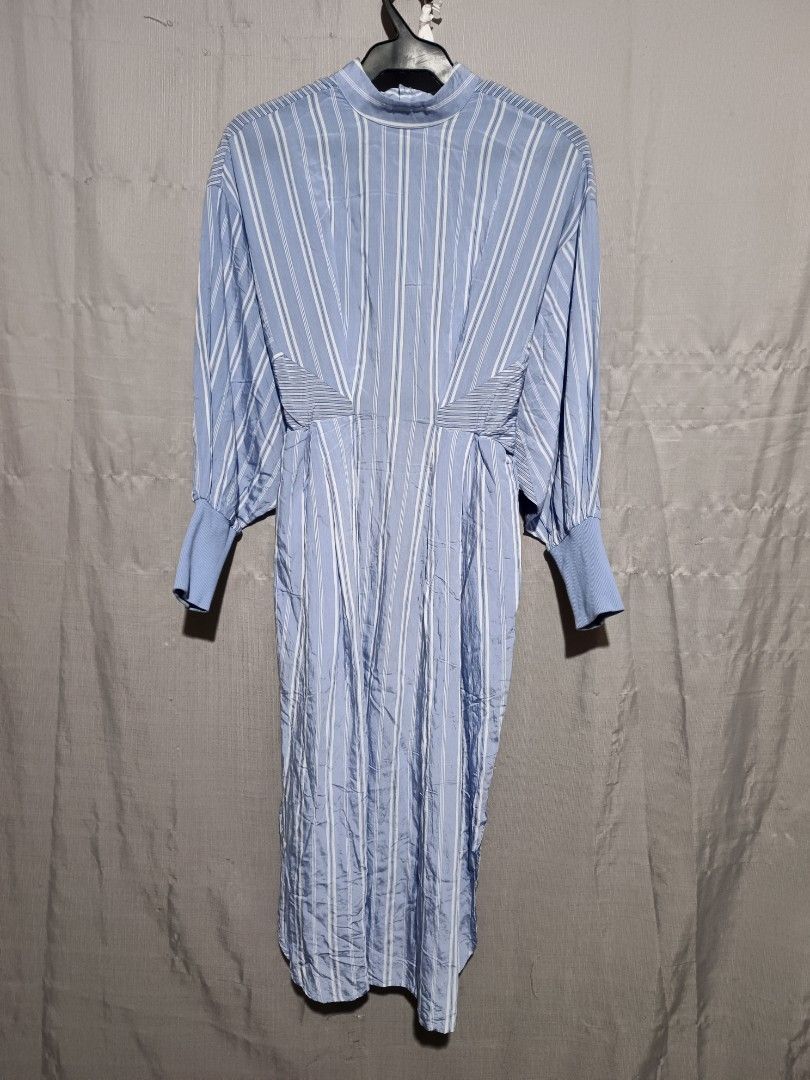 Initial Striped Midi Dress (Category: Dresses) located in Dasmarinas. Submitted by jessputrages (Listing ID 1419555983, Image 1). Description: - Initial midi dress - Light blue and white striped pattern - Long sleeves with cuff details - Mock neck - Fitted waist - Flowing skirt - Fabric: Rayon and nylon blend - Care: Professional dry clean only.