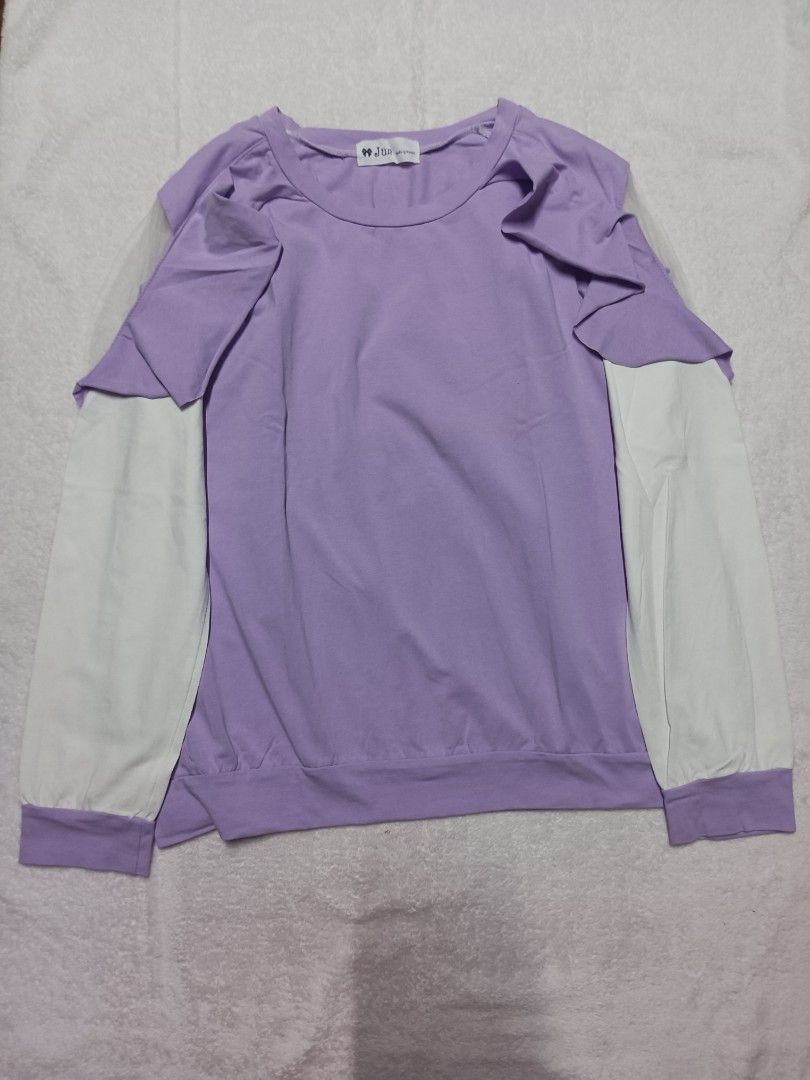 Jun Purple Layered Top (Category: Blouses) located in Malabon City. Submitted by mslalan (Listing ID 1419401332, Image 1). Description: - Layered design - Purple body, white sleeves - Round neckline - Cuffed sleeves - Soft, comfortable fabric - Brand tag visible - Ideal for casual wear.