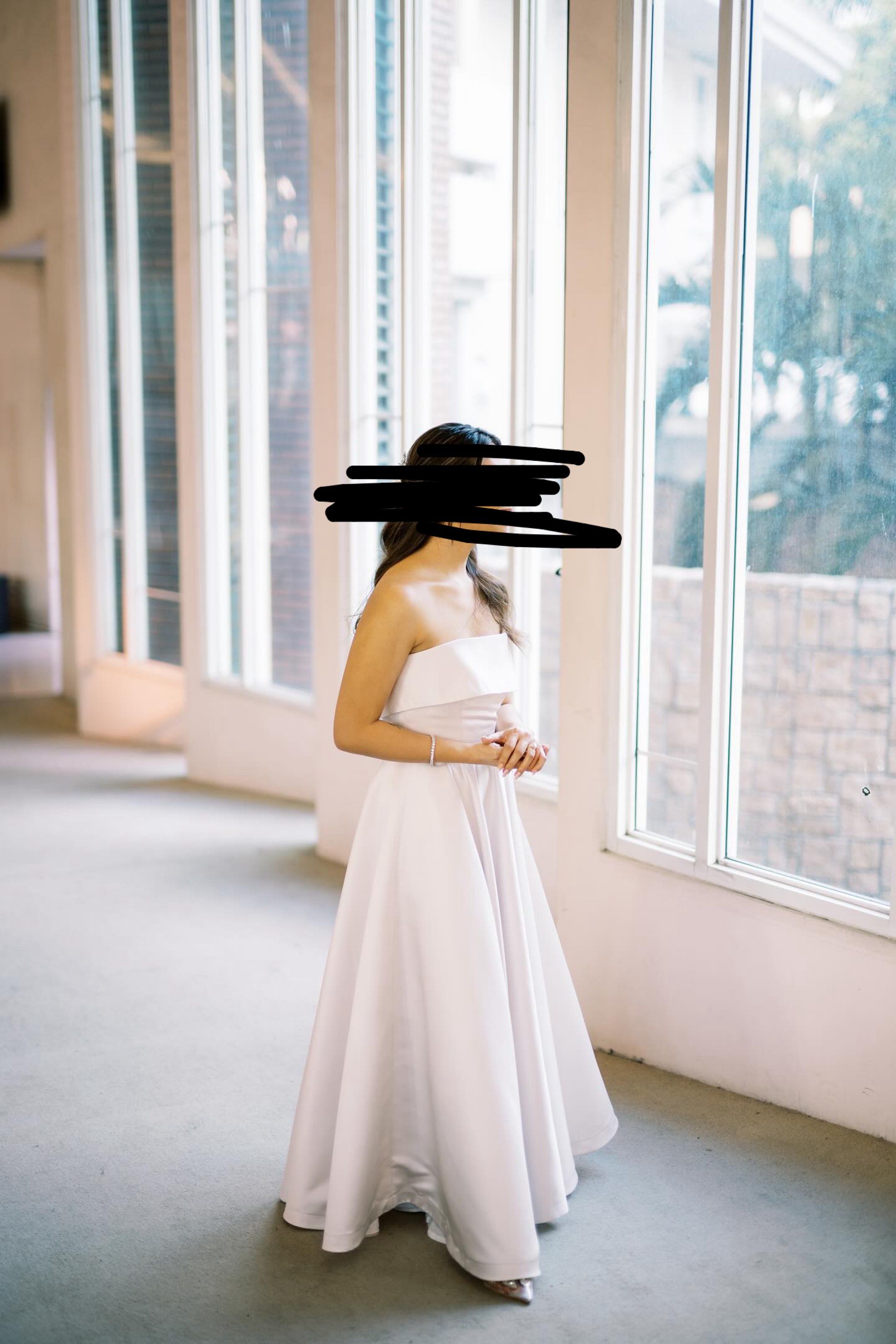 June 12 The Label White Dress (Category: Evening dresses & gowns) located in Quezon City. Submitted by maveeyy (Listing ID 1419504697, Image 1). Description: - Strapless / tube white gown - Fitted bodice - Flowing A-line skirt - Simple, classic design - Duchess satin fabric - Pearl white Cruz dress, custom made by June 12 the Label. Used only once for our small church wedding. Height: 5”3,Bust: 34, Waist: 28 Original price: 8-10k depending on the