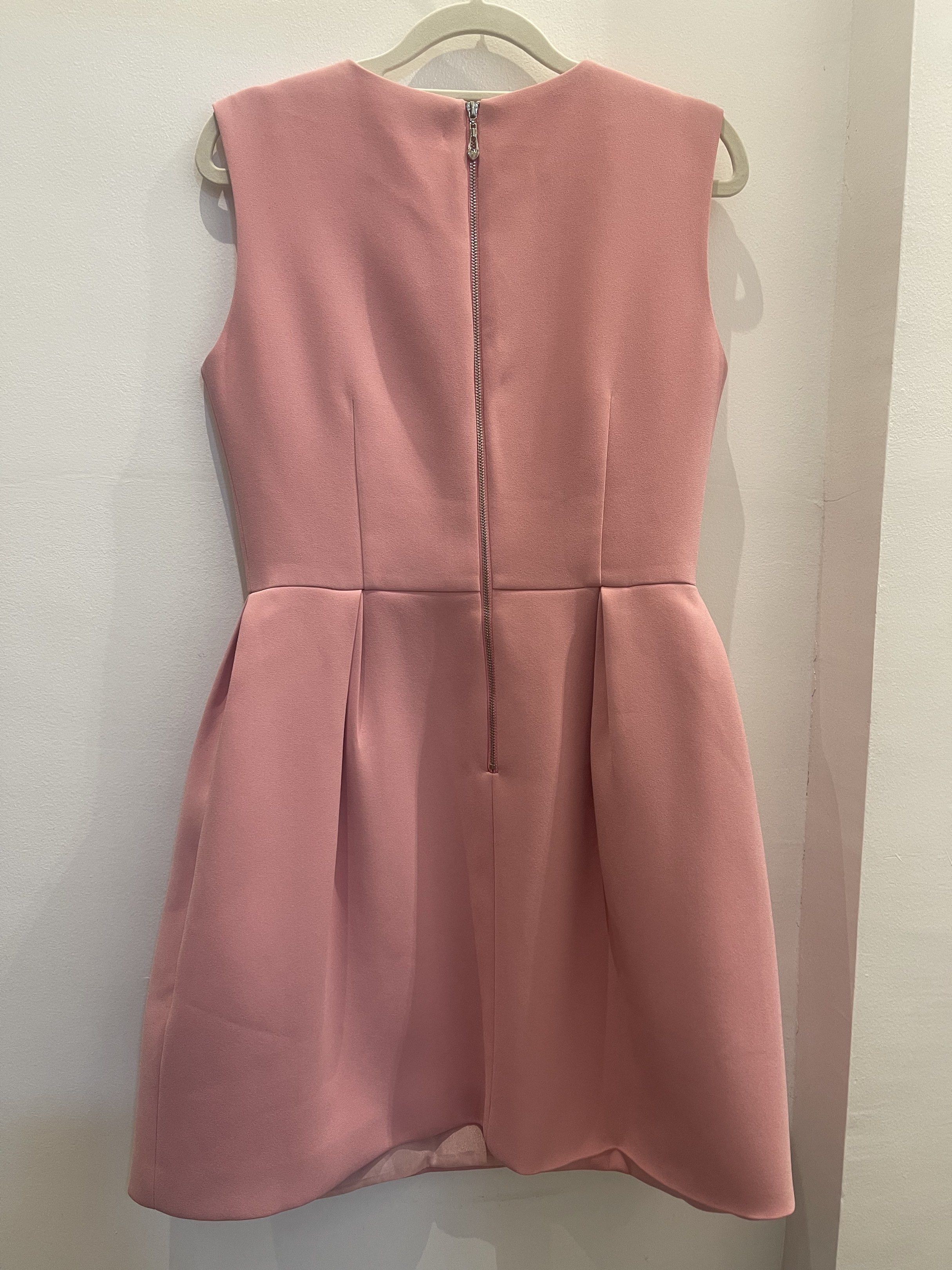 Kate Spade Sleeveless Dress (Category: Dresses) located in Tacloban City. Submitted by declutterwithbel (Listing ID 1419408293, Image 3). Description: - Elegant sleeveless dress from Kate Spade. - Features a flattering A-line silhouette with a fitted bodice and a flared skirt. The dress has a front button detail (decorative only) and a back zipper closure. The dress is a soft pink color. - Runs about 85cm in length, 41 cm chest (laid flat) - Fits
