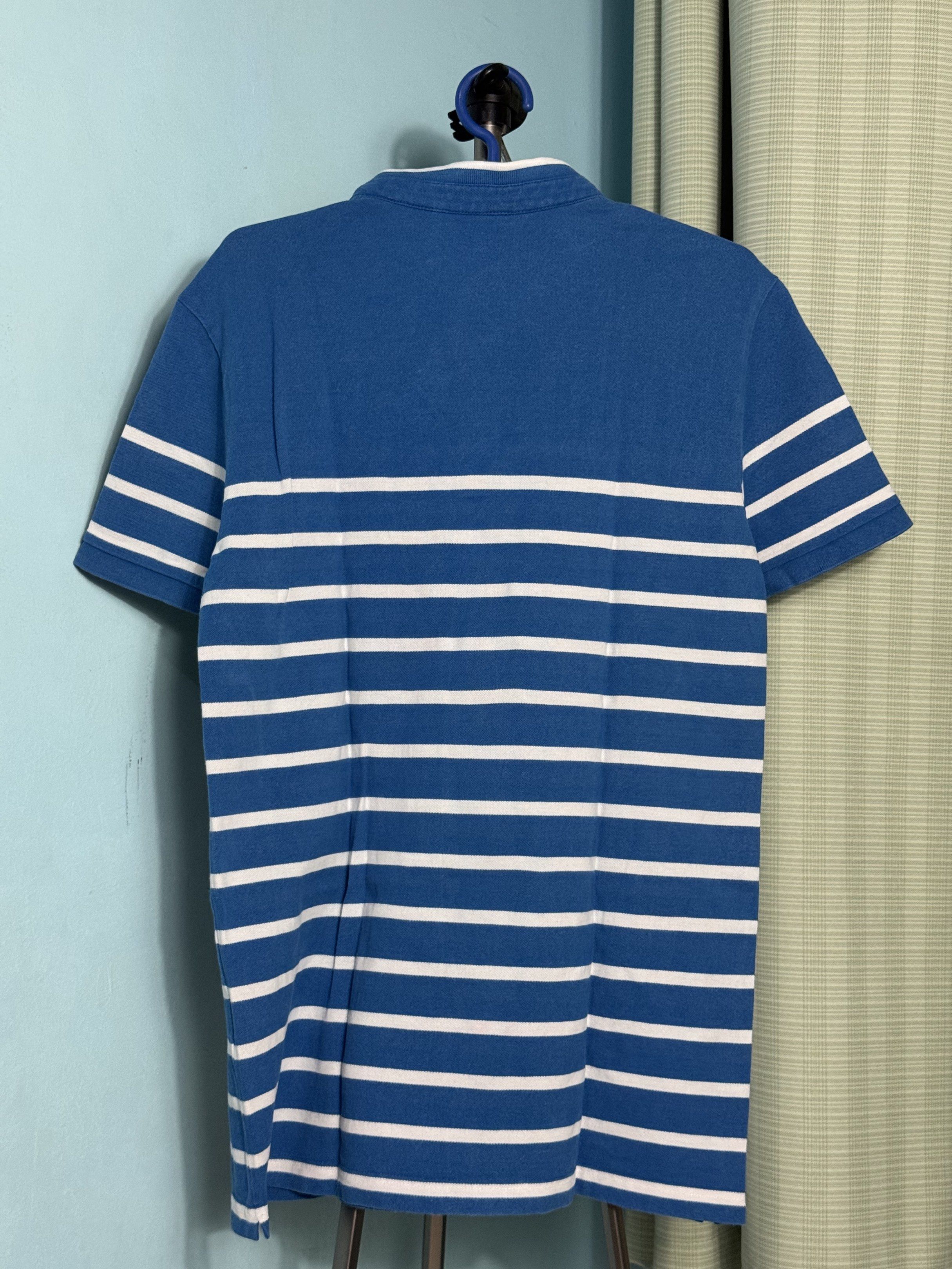 Lacoste Slim Fit Polo Shirt (Category: Tshirts & Polo Shirts ) located in Muntinlupa City. Submitted by ohlourdt (Listing ID 1419503270, Image 3). Description: - Blue Lacoste polo shirt - Size: FR4 / USM - Classic Lacoste logo on the chest - Slim fit design - Chinese collar - White trim details.