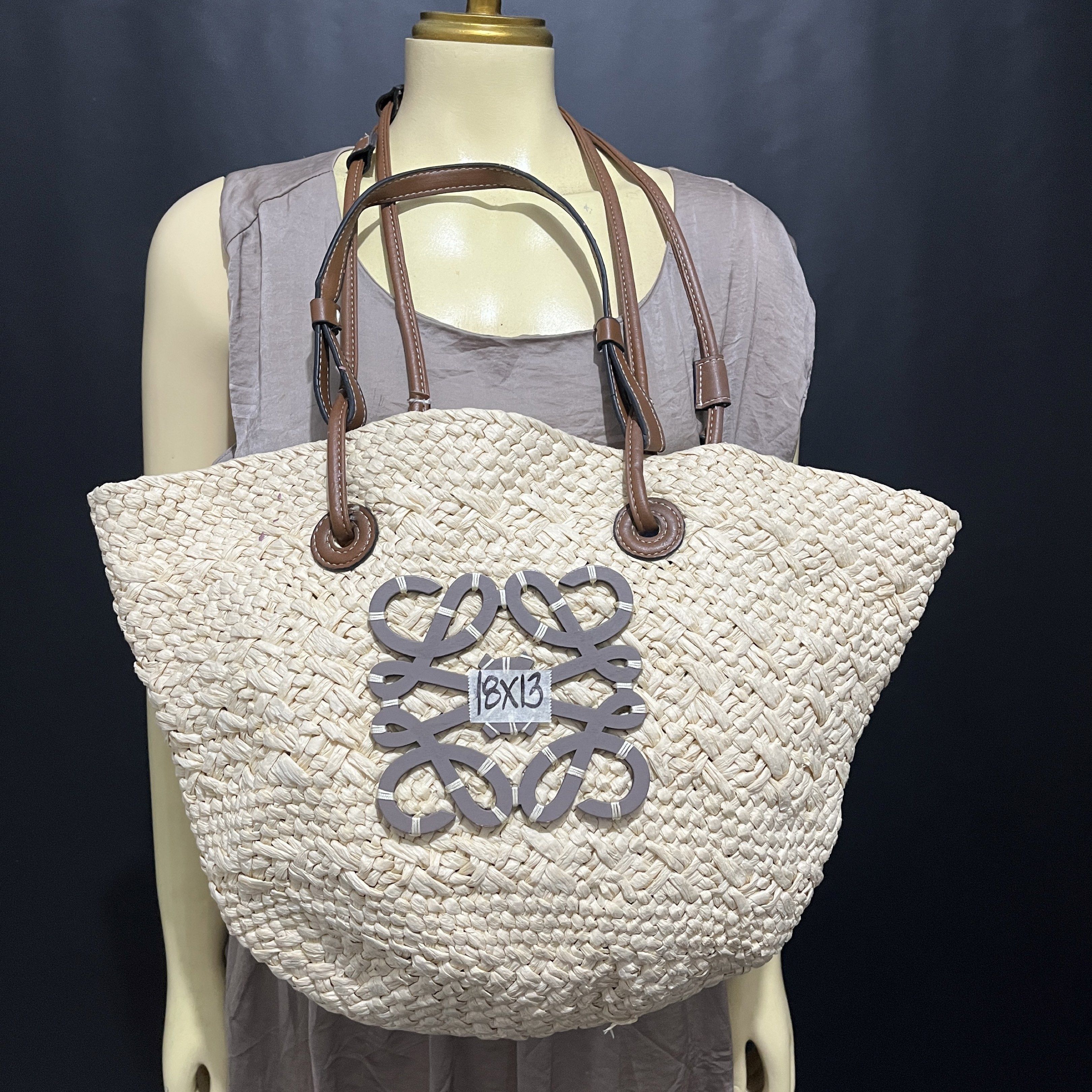 Loewe Basket Tote Bag (Category: Luxury Bags & Wallets) located in Cabadbaran. Submitted by dfgthriftology (Listing ID 1419536442, Image 1). Description: - Woven straw design. - Brown leather handles and shoulder strap. - Features the Loewe logo. - Spacious interior, perfect for daily essentials. - See interior in photos..