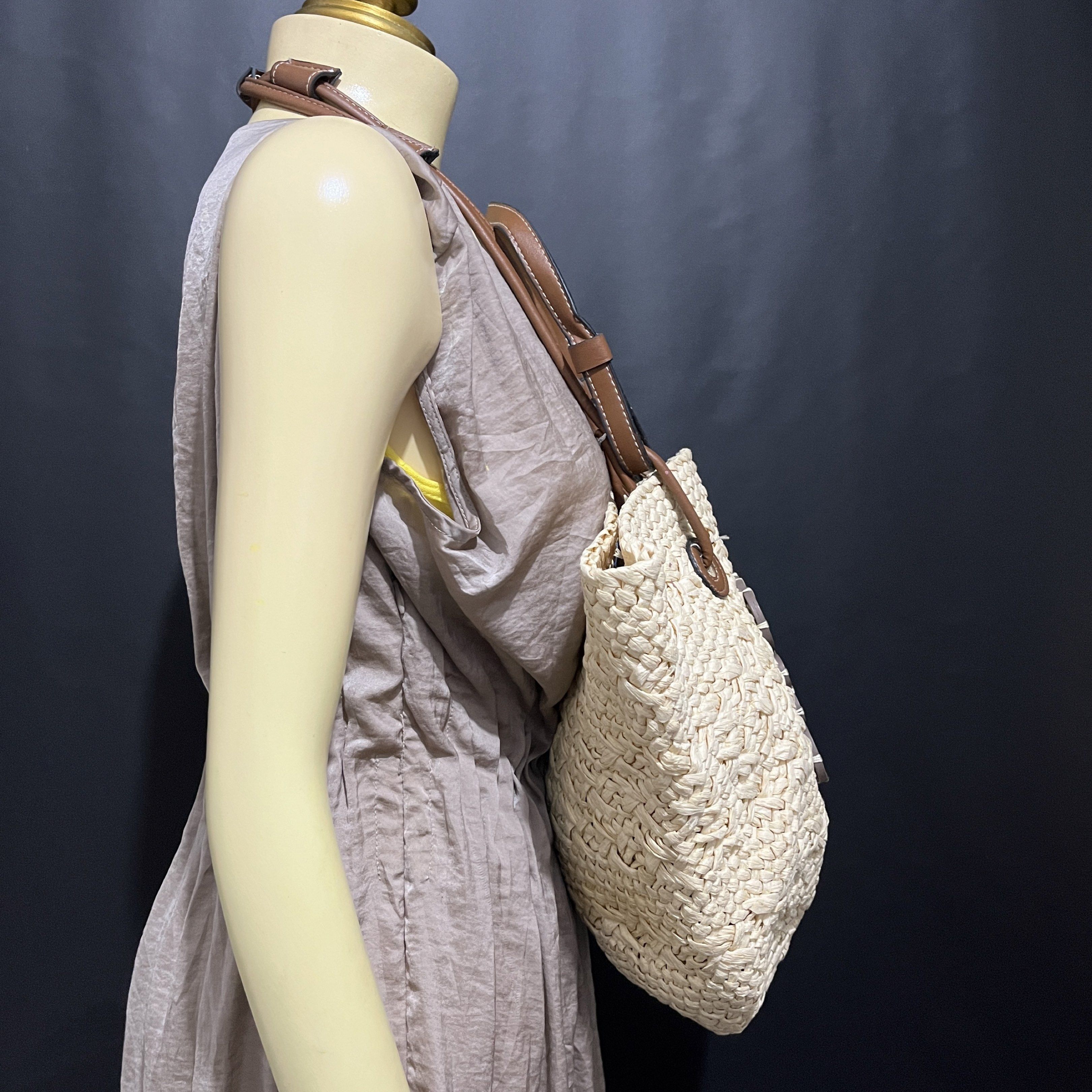 Loewe Basket Tote Bag (Category: Luxury Bags & Wallets) located in Butuan. Submitted by dfgthriftology2.0 (Listing ID 1419544258, Image 2). Description: - Woven straw design. - Brown leather handles and shoulder strap. - Features the Loewe logo. - Spacious interior, perfect for daily essentials. - See interior in photos..