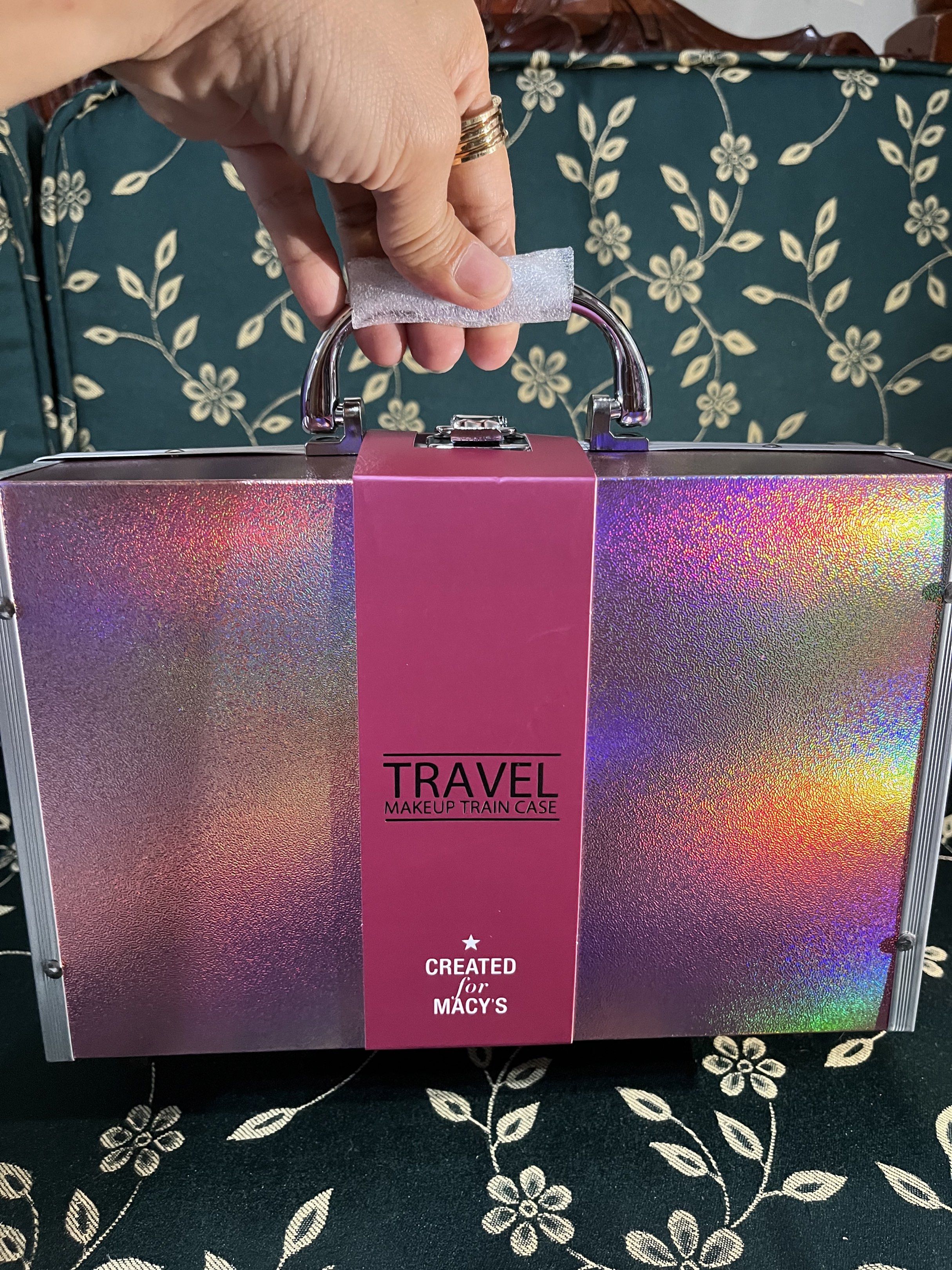 Macy's Travel Makeup Train Case (Category: Makeup) located in Las Pinas. Submitted by jaimelyscent_ (Listing ID 1419584993, Image 1). Description: Travel makeup train case from Macy's includes 32 eyeshadows, 4 blushes, 2 lip wands, 2 lipsticks, duo highlighter, duo bronzer, duo eyeliner, and duo lip liner. It has a handle for easy carrying and multiple compartments for organizing your makeup. The case is a holographic pink color and has a secure 