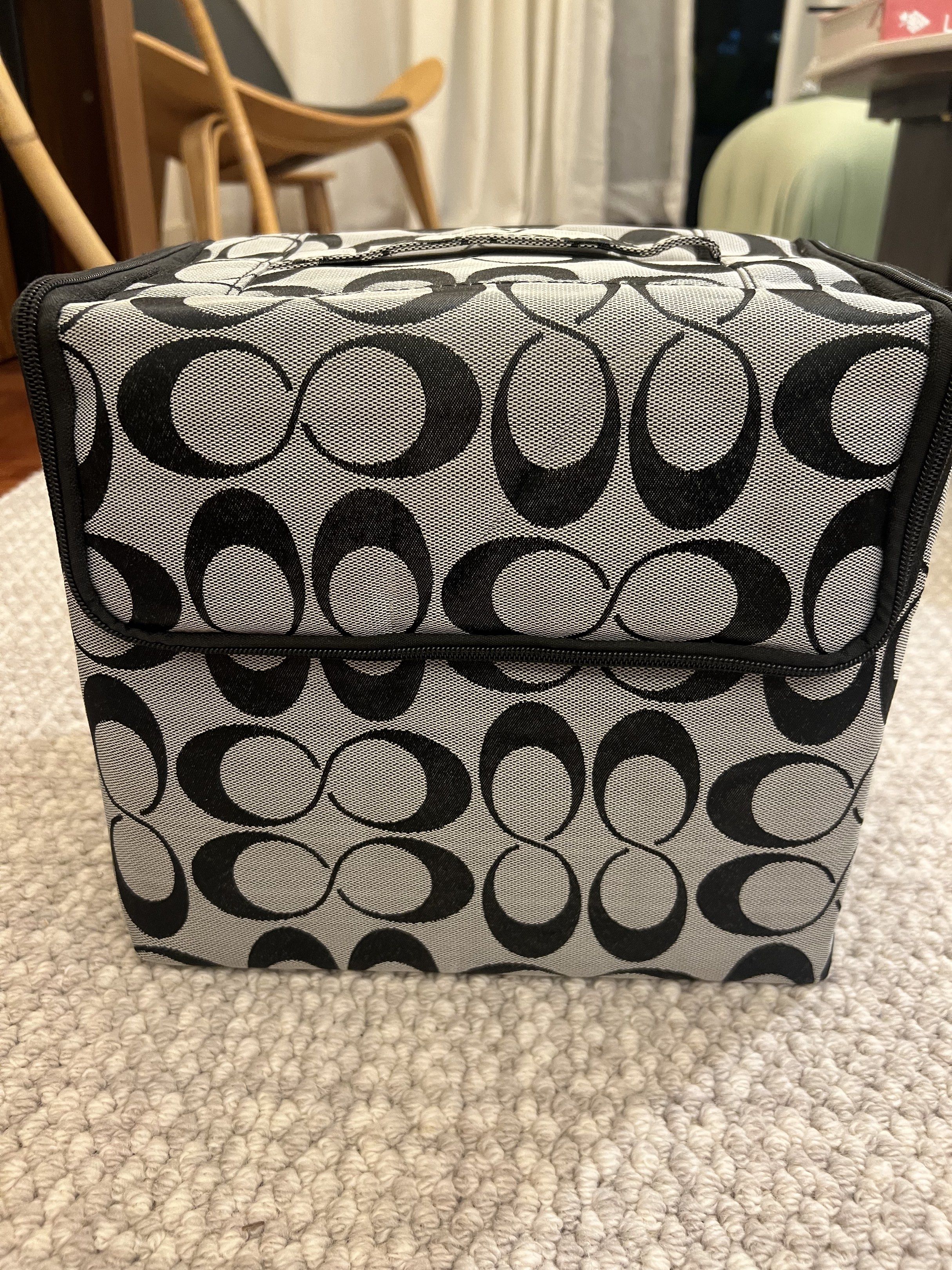 Makeup Case with Multiple Compartments (Category: Purses & Pouches) located in Kuala Lumpur. Submitted by crystal88lai (Listing ID 1419564673, Image 3). Description: - Stylish makeup case - Black and grey pattern - Multiple compartments and trays for organization - Includes zippered pouch with brush pockets - Convenient handle for carrying - Secure zip closure.