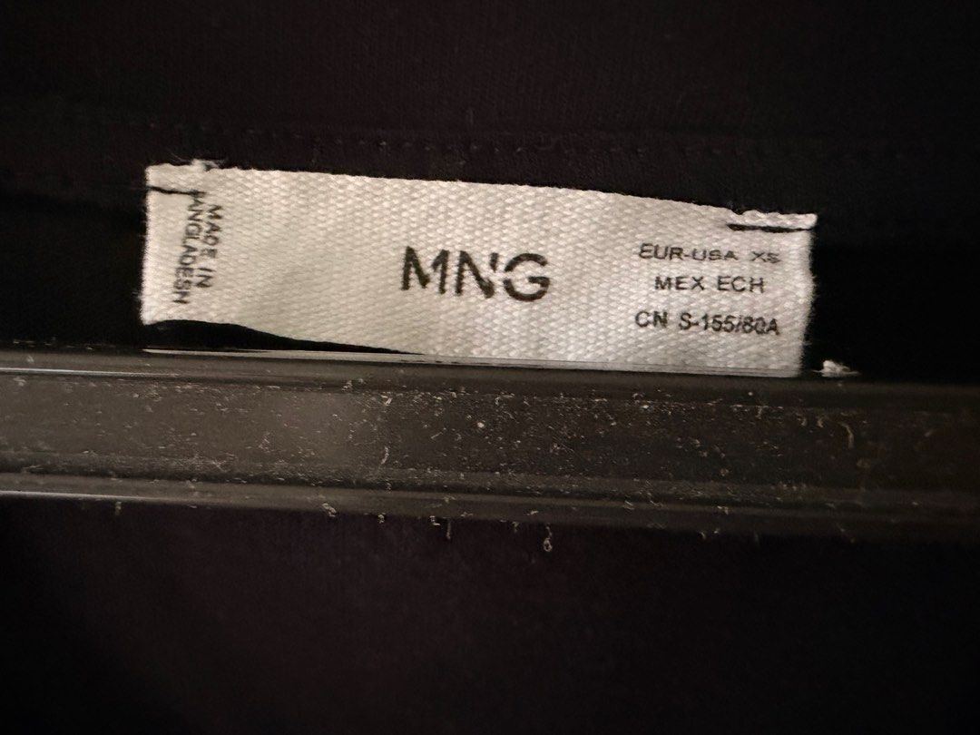 Mango Black Cotton V-neck T-shirt (Category: Shirts) located in Quezon City. Submitted by closetsweeper11 (Listing ID 1419465074, Image 2). Description: Apologies for the un-ironed state. Still in okay condition. RFS: Weight gain.