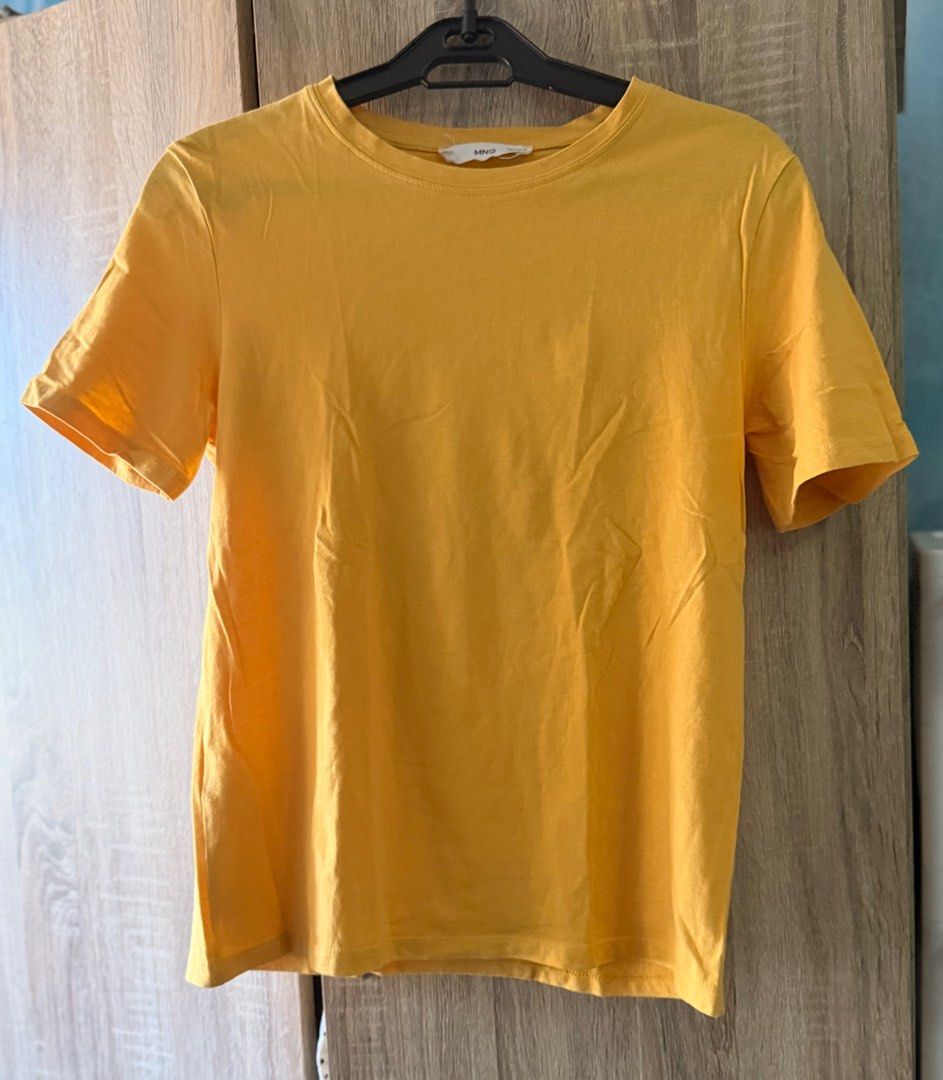 Mango Yellow Cotton T-shirt (Category: Shirts) located in Quezon City. Submitted by closetsweeper11 (Listing ID 1419464853, Image 3). Description: Apologies for the un-ironed state. Still in okay condition. RFS: Weight gain .