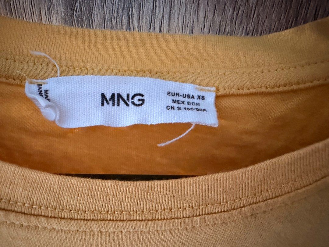 Mango Yellow Cotton T-shirt (Category: Shirts) located in Quezon City. Submitted by closetsweeper11 (Listing ID 1419464853, Image 2). Description: Apologies for the un-ironed state. Still in okay condition. RFS: Weight gain .
