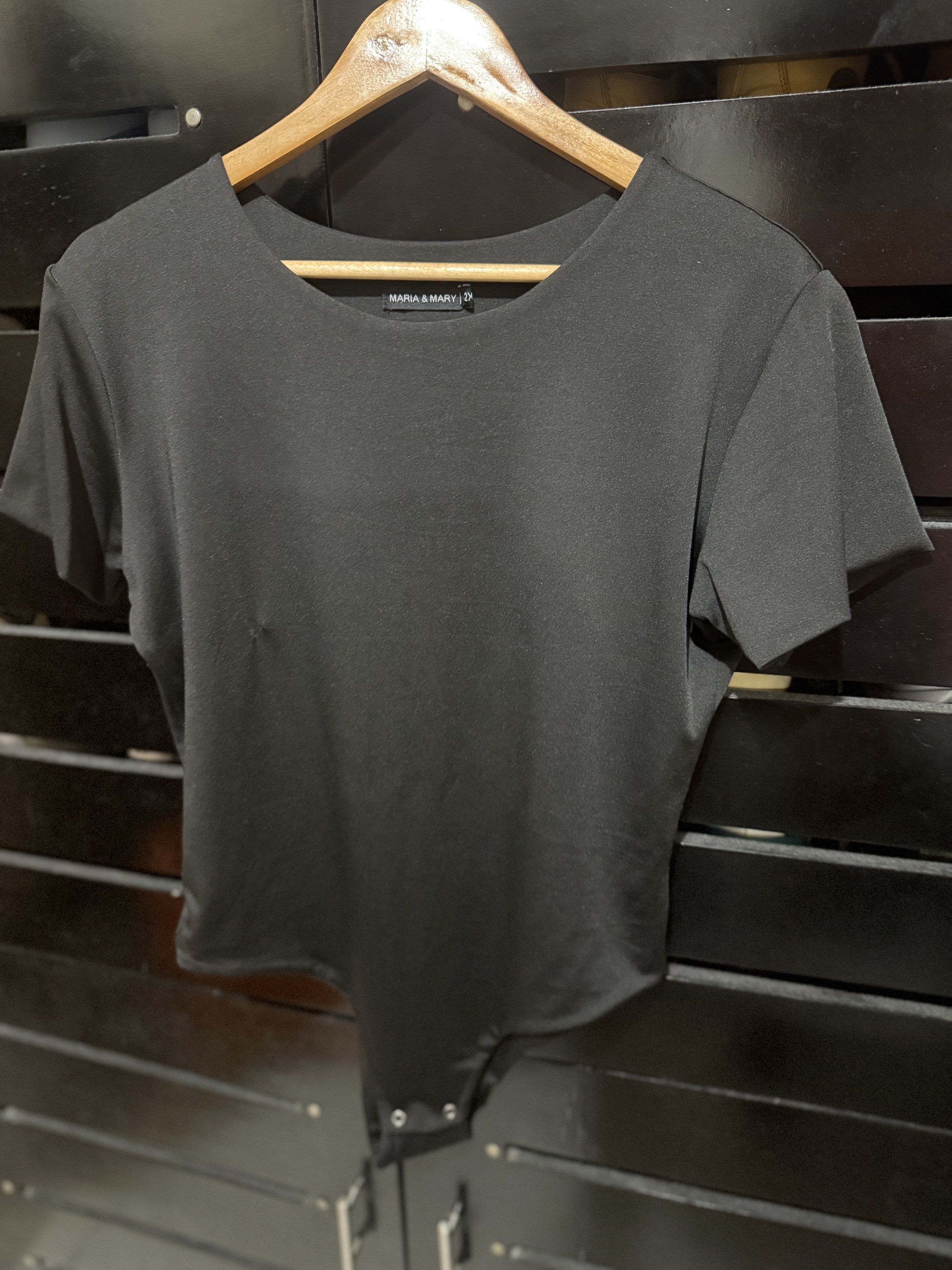 Maria & Mary Black Bodysuit 2X (Category: Others Tops) located in Pasig City. Submitted by kingdomgeneral (Listing ID 1419400023, Image 1). Description: - Maria & Mary bodysuit - Color: Black - Size: 2X - Features: - Short sleeves - Scoop back - Snap closures at the bottom.