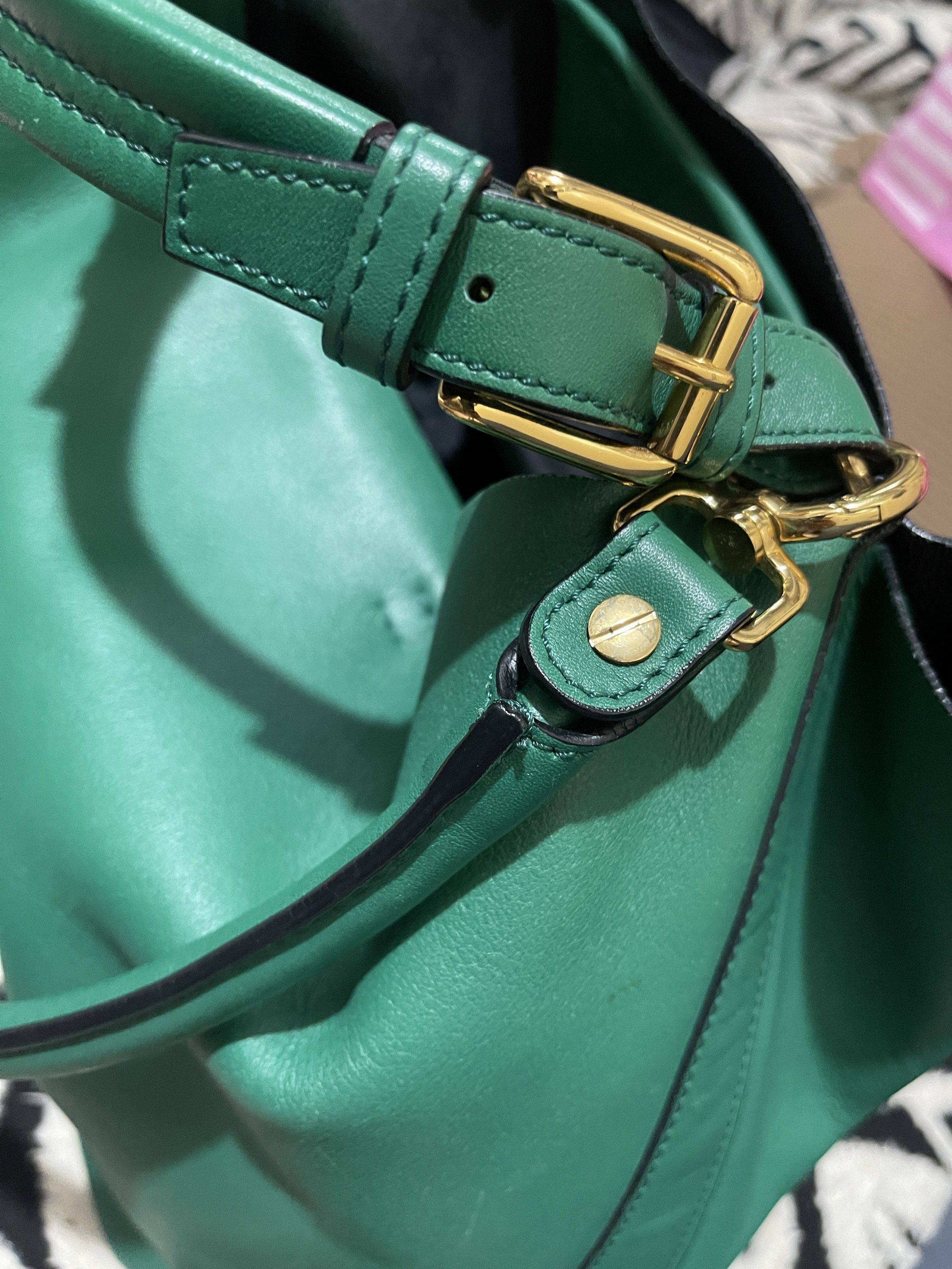 Marni Green Leather Handbag (Category: Luxury Bags & Wallets) located in Muntinlupa City. Submitted by yvethhant70925 (Listing ID 1419485279, Image 3). Description: - Marni green leather handbag - Top handle and detachable shoulder strap - Interior with drawstring pouch and small pocket - Gold-tone hardware - Spacious interior - Structured design - Vibrant green color.