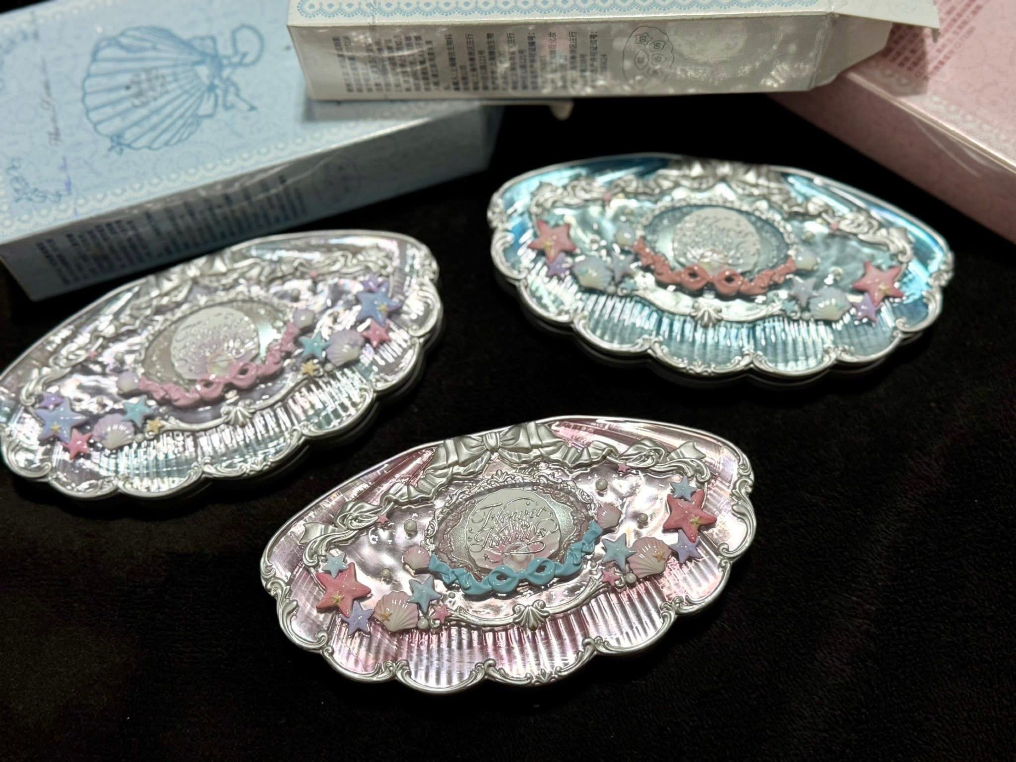 Mermaid Shell Eyeshadow Palette (Category: Makeup) located in Manila. Submitted by n4thlie (Listing ID 1419526291, Image 1). Description: - Shell-shaped eyeshadow palette - Unique star and shell-shaped eyeshadows - Includes a mirror - Available in multiple colors - Shell-themed packaging.